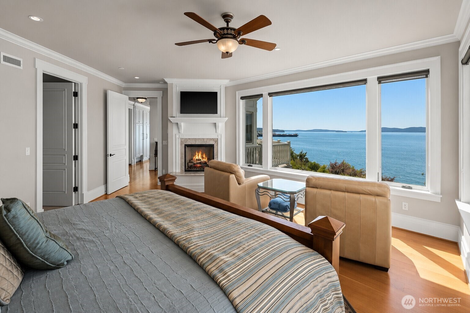 The only bedroom on the main level, this private guest suite offers exceptional comfort, generous space, and beautiful waterfront views.