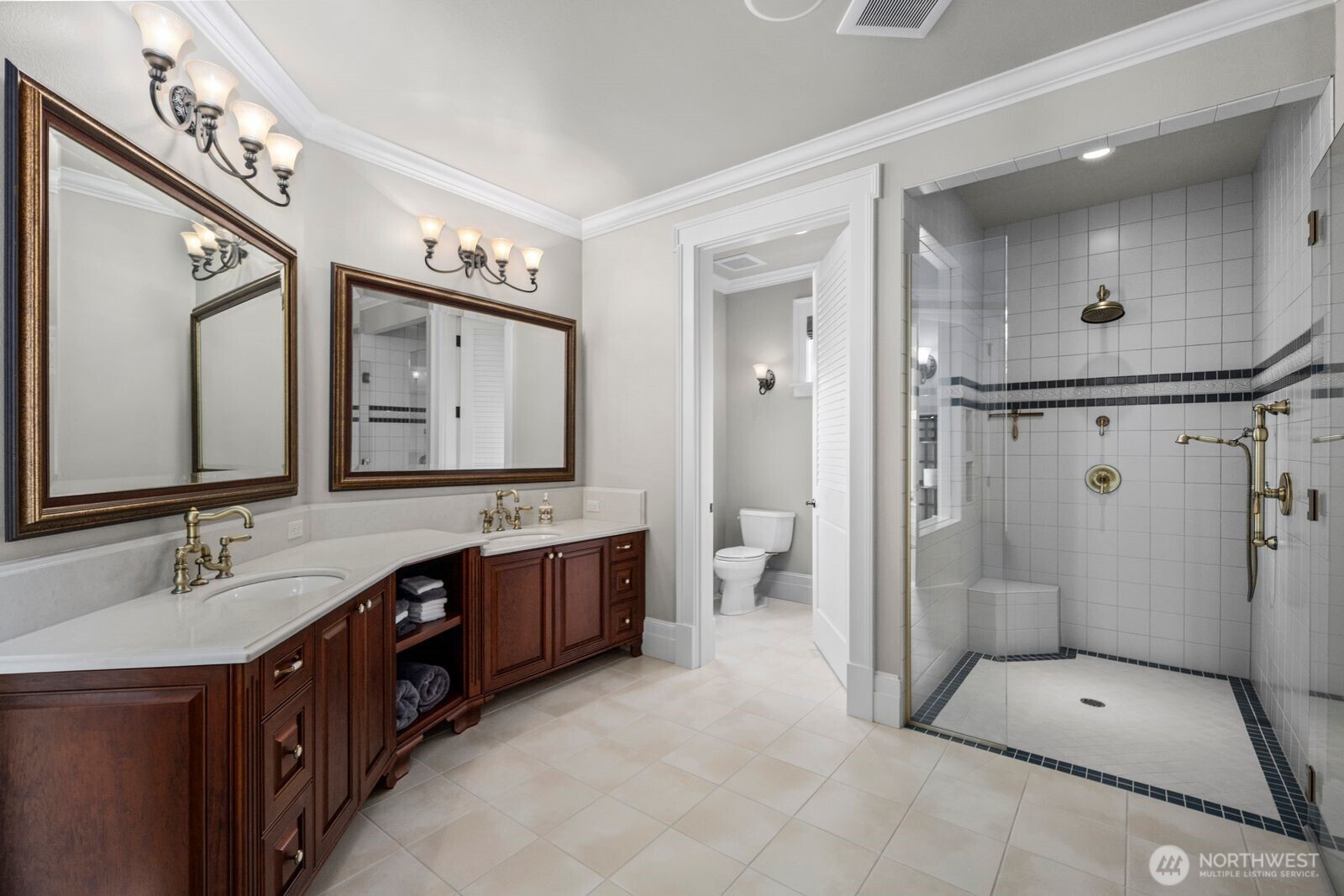 Classic elegance meets everyday comfort in this guest bath, featuring a stunning clawfoot tub, spacious shower, and refined finishes.