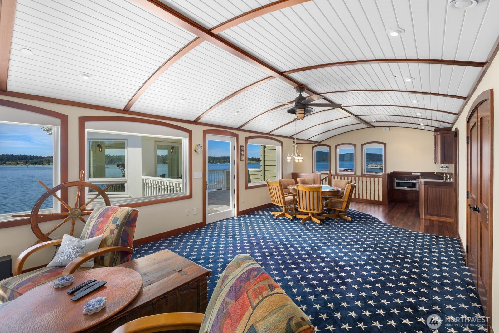 Inspired by the interior of a classic yacht, the crow’s nest features rich wood detailing, nautical craftsmanship, and panoramic water views.