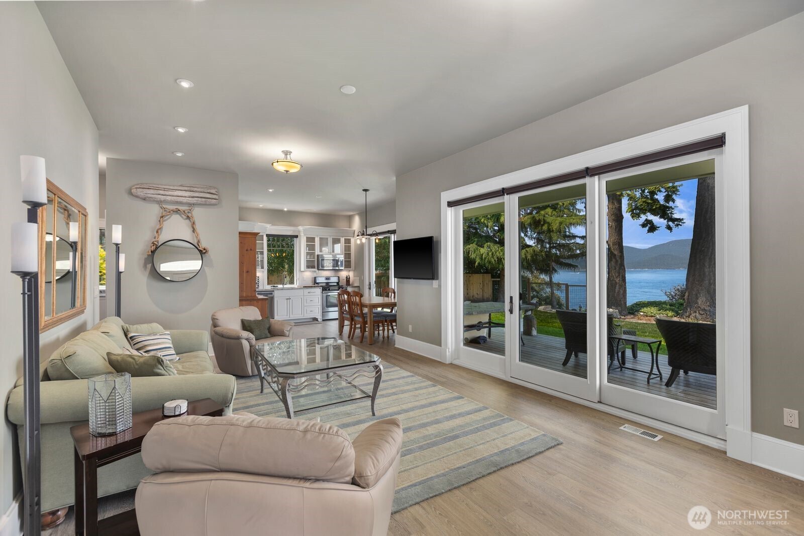 Thoughtfully designed for privacy and independence, the guest cottage features inviting living spaces and stunning waterfront views.