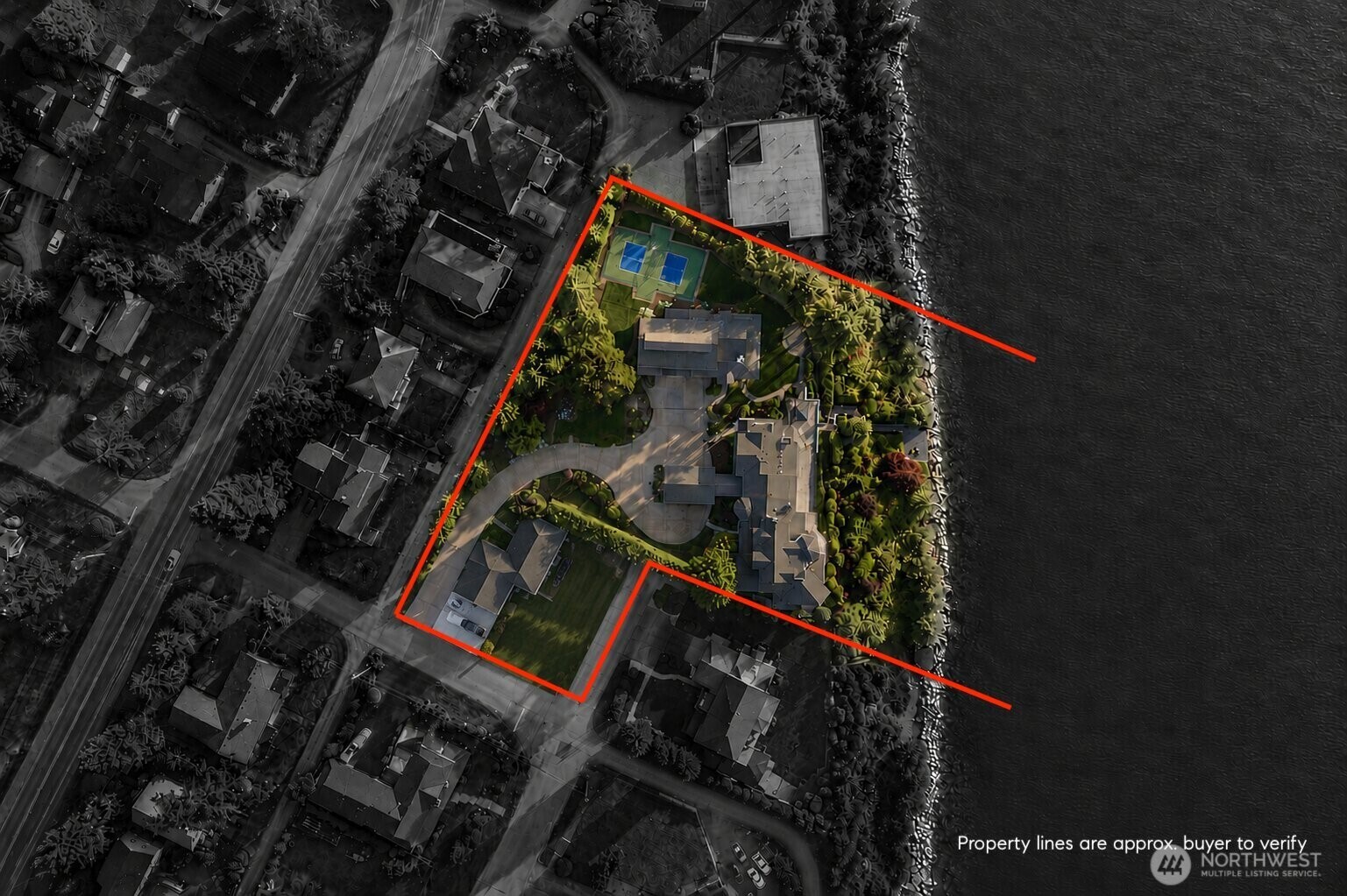Encompassing multiple parcels, the estate offers an extraordinary combination of privacy, amenities, and expansive waterfront living.