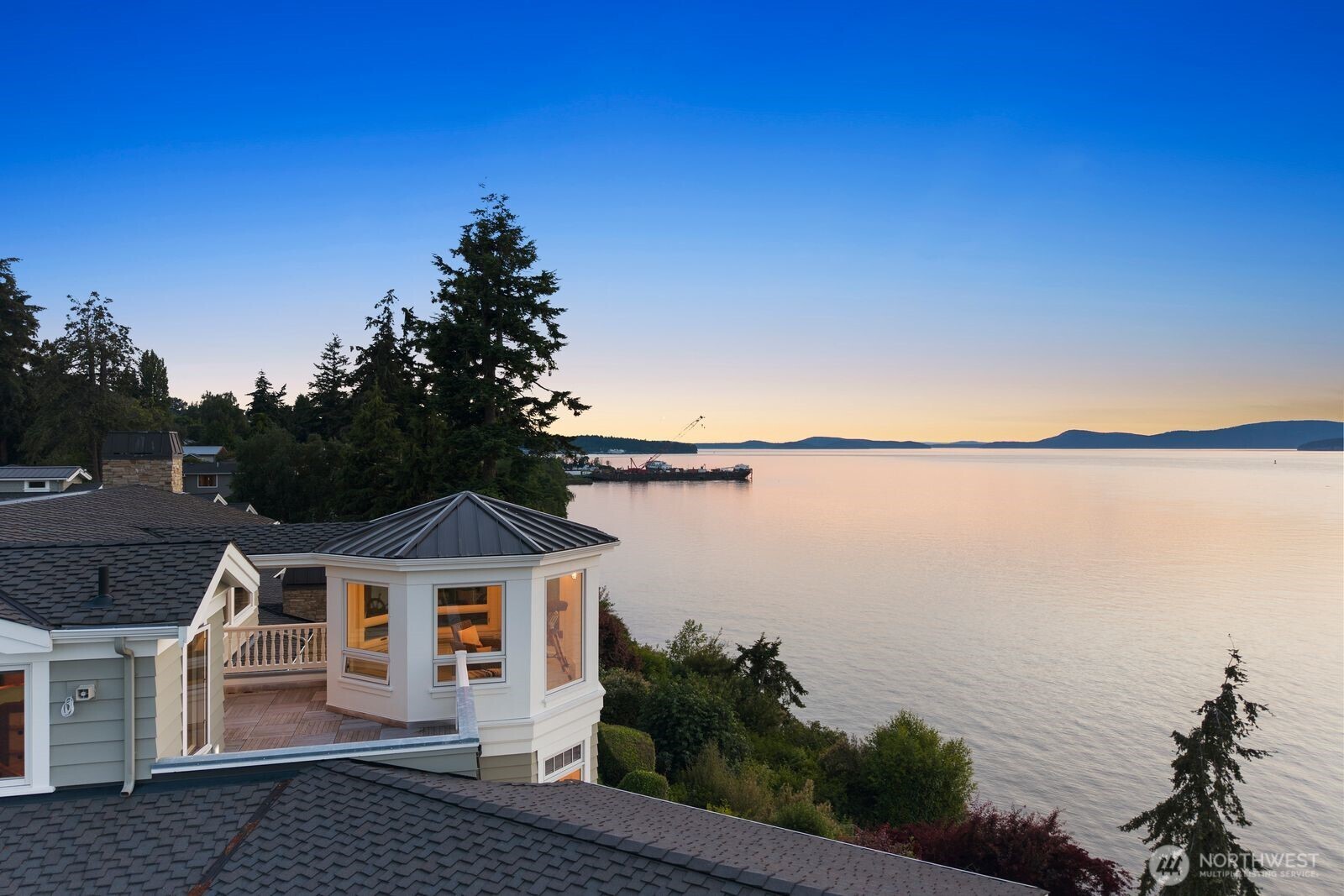 From sunrise to sunset, enjoy panoramic views of the Guemes Channel, passing boats, and the ever-changing beauty of waterfront living.