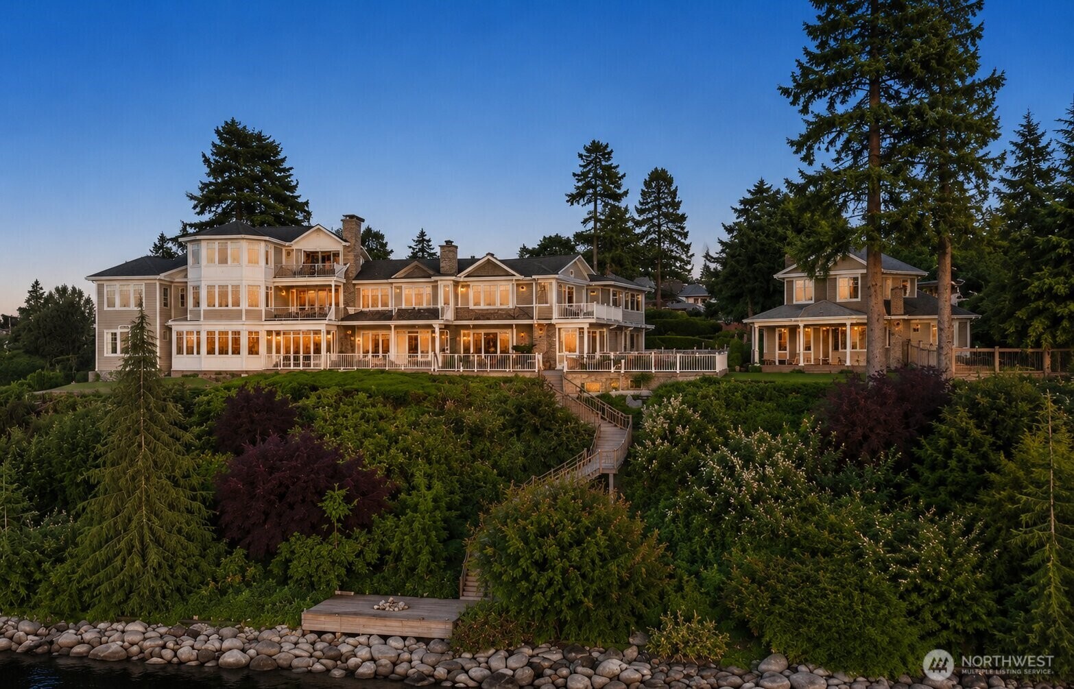 Aerial perspective showcasing the estate's impressive scale, beautifully landscaped grounds, and coveted in-town waterfront setting.