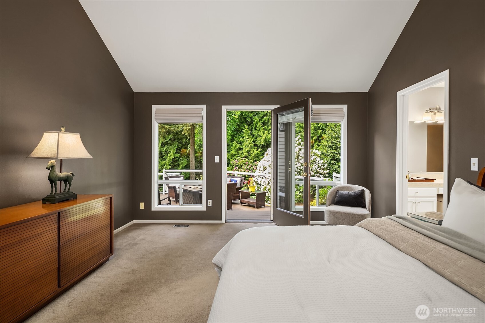 Main floor office  or 4th bedroom, with built-in bookshelves & closet space.