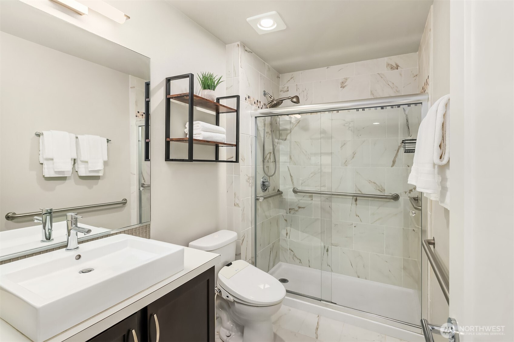 Upgraded three quarter bath on the lower level - attached to the lower level bedroom, making for a very private, and luxurious guest suite. Great for multi-generational living or extended guests