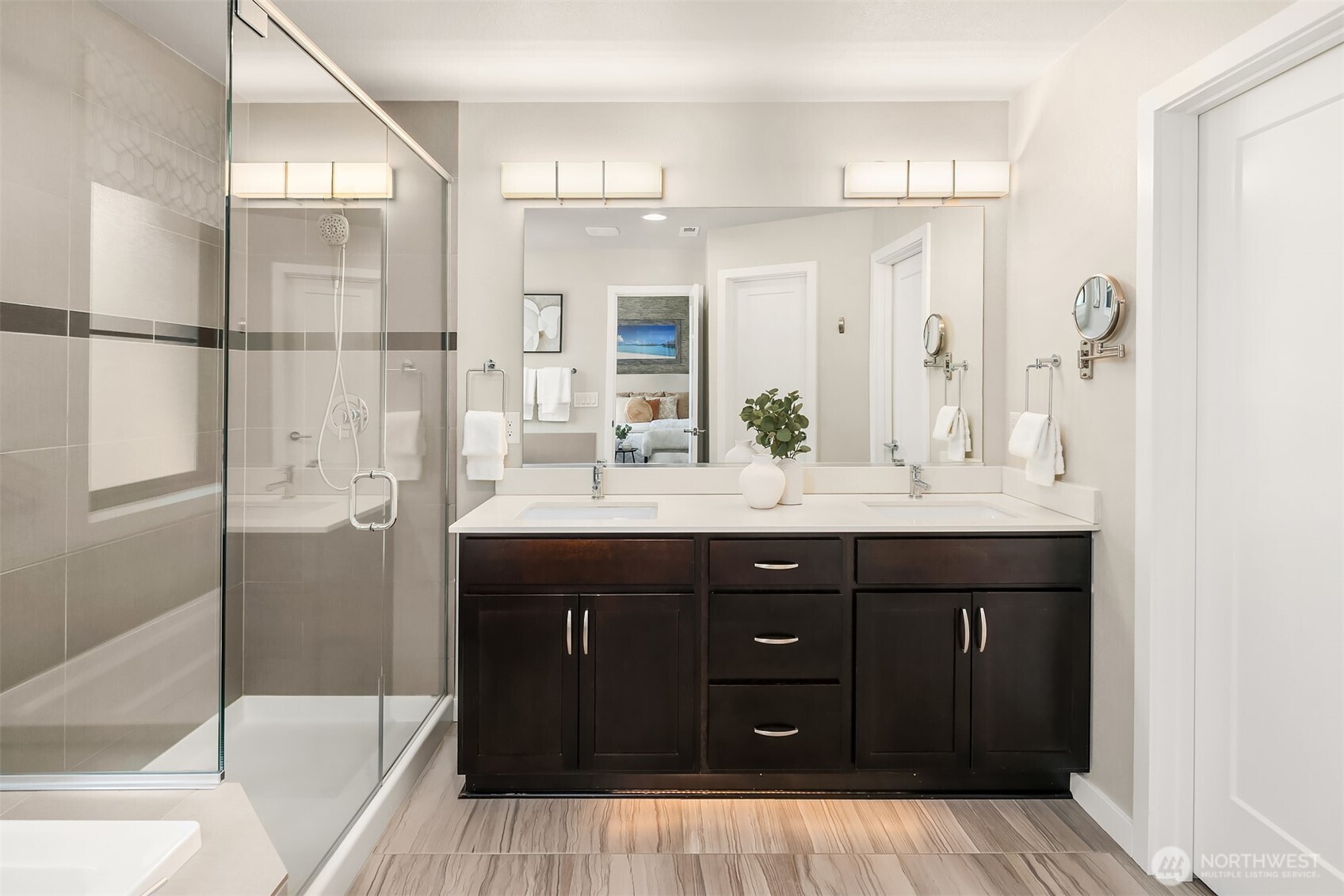 Primary bath with dual vanities, walk-in shower and soaking tub