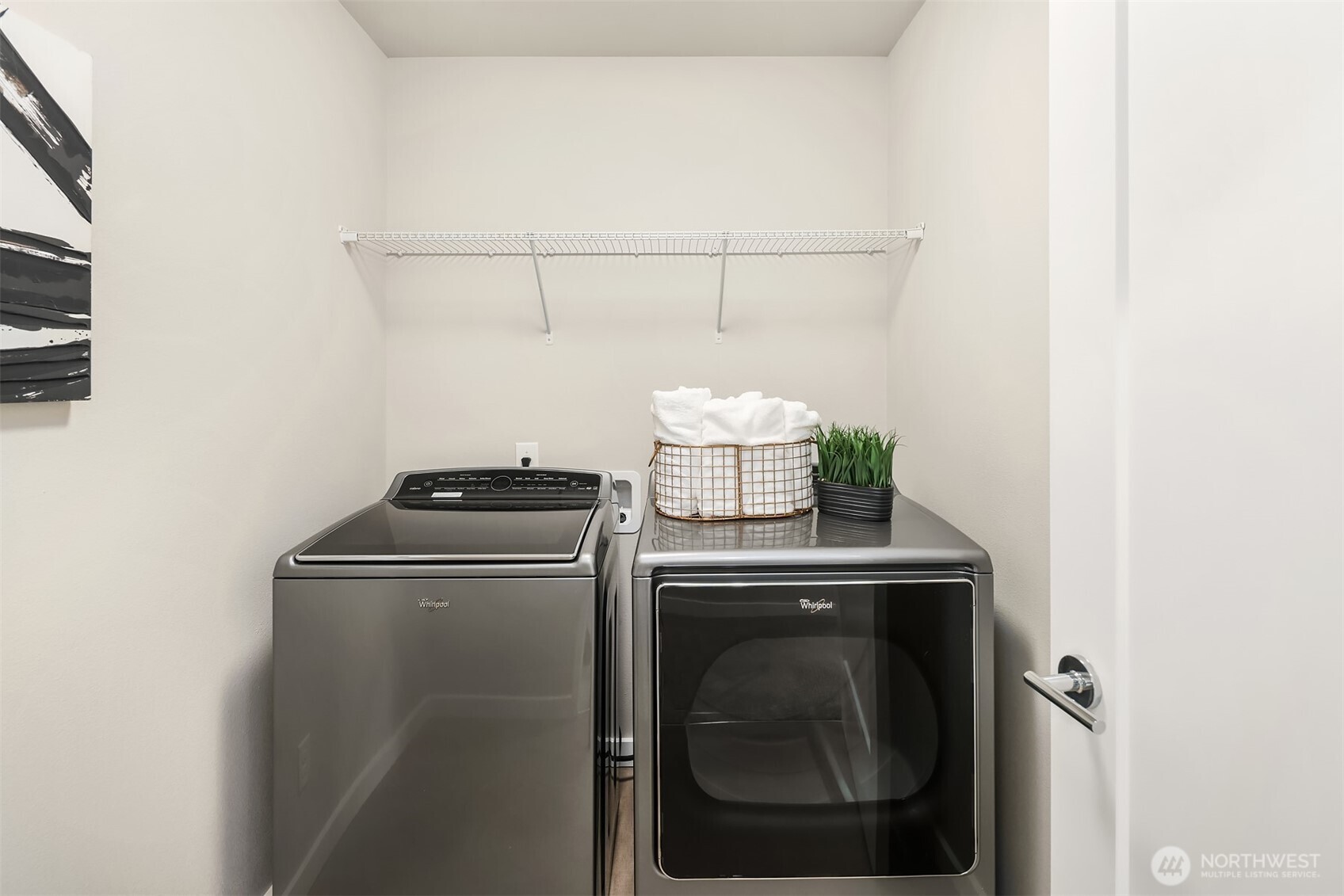 Upper level laundry room - full size machines with room for storage!