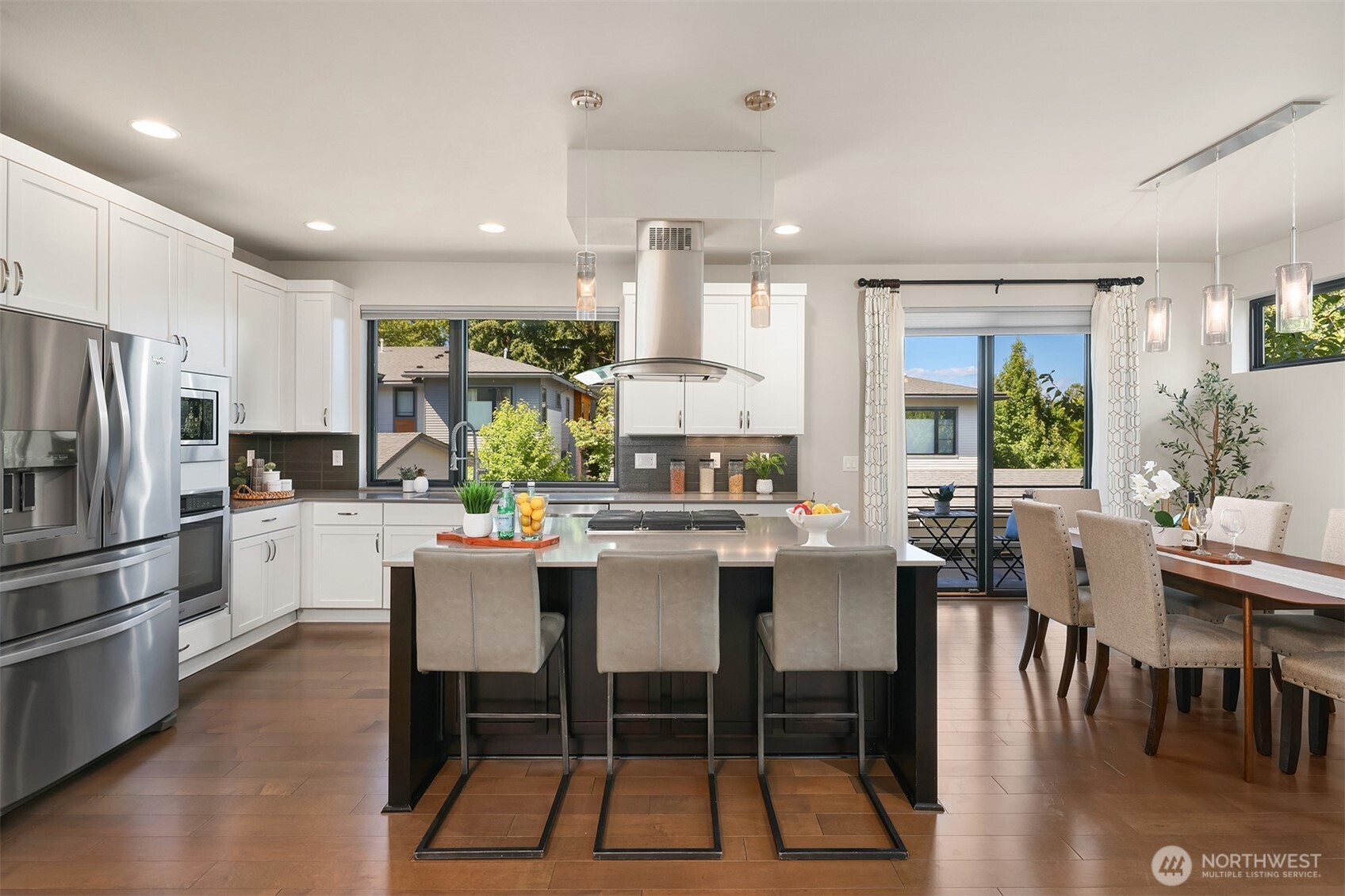 The kitchen, with a large central island is a focal point of the home and immediately grabs attention.