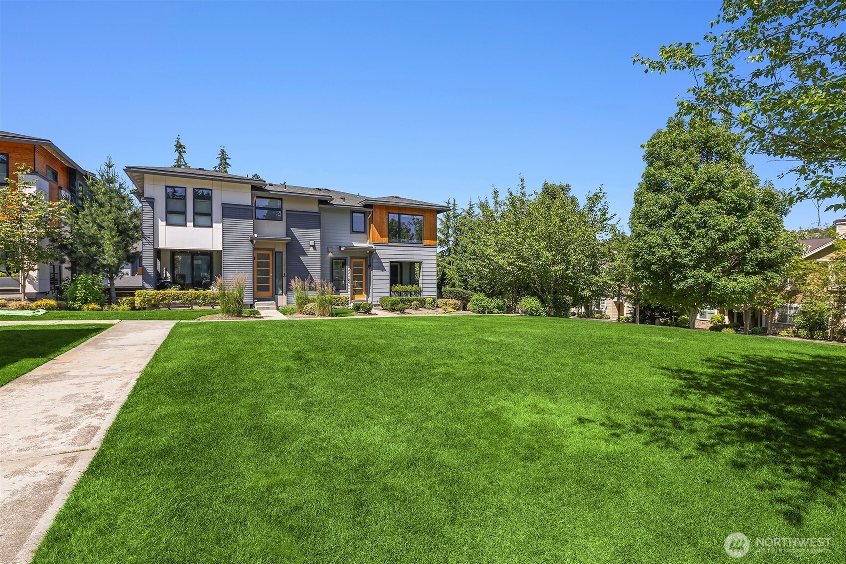 The home overlooks the community green space. There's also guest parking spots within the community