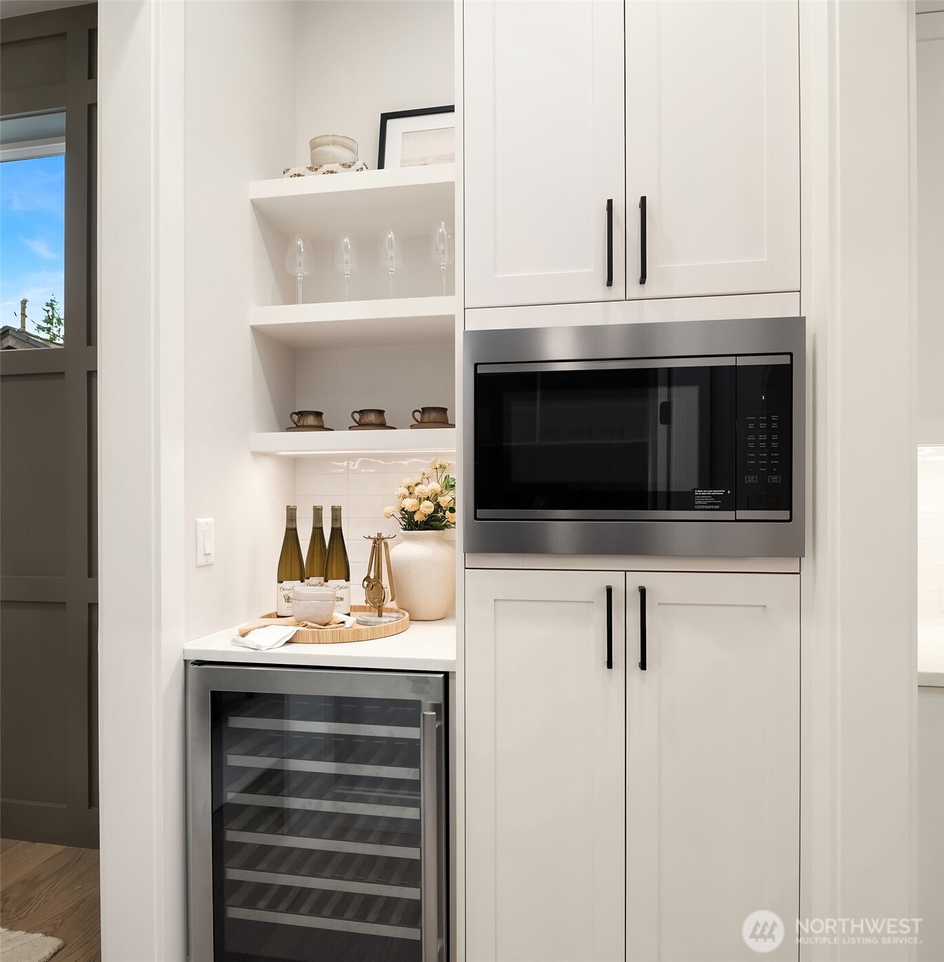 Butler's pantry adjacent to full walk-in pantry.