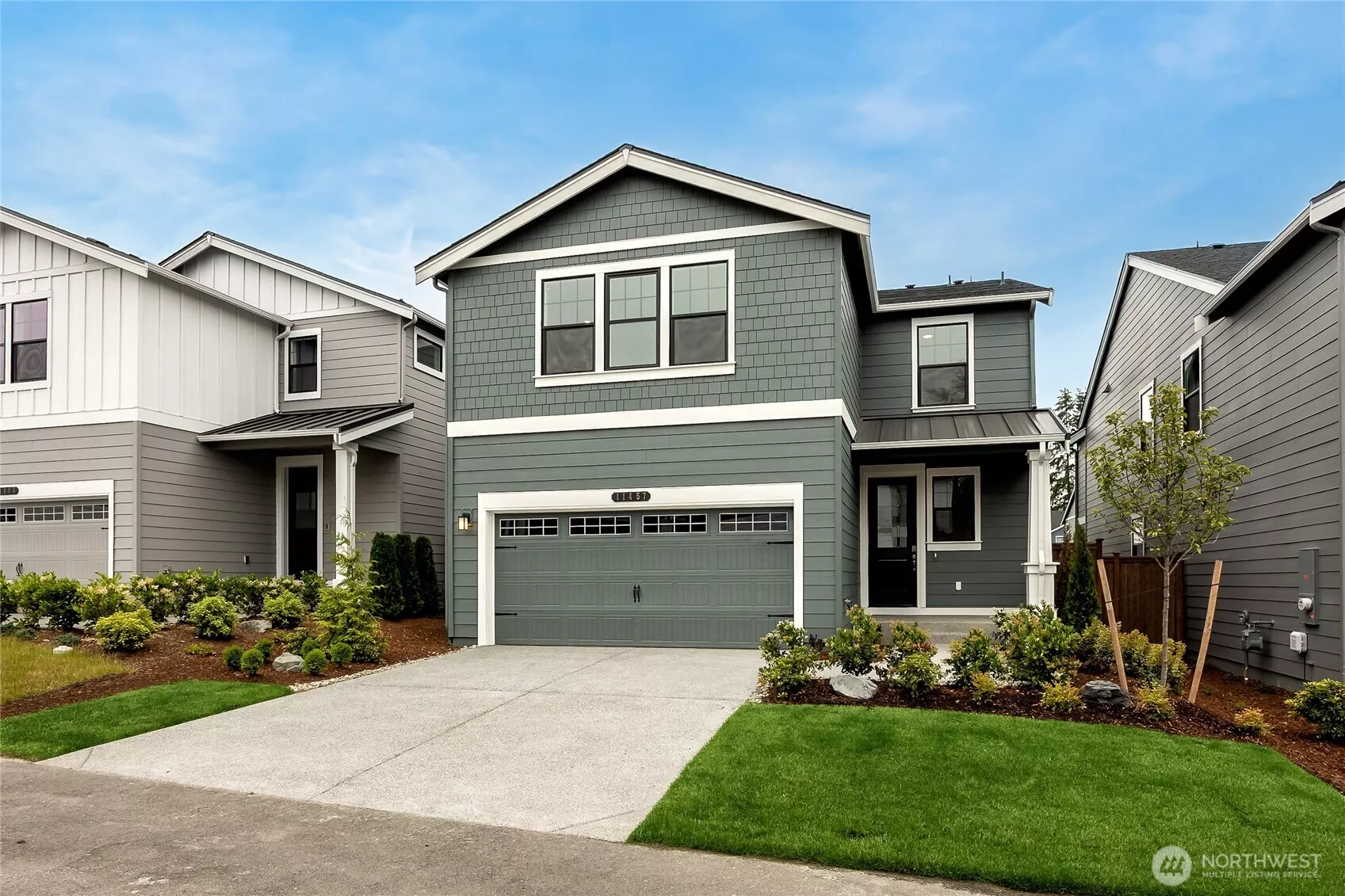 Photo for representational purposes only, actual elevation and colors are slightly different.  2-Car garage with 50AMP EV plug.
