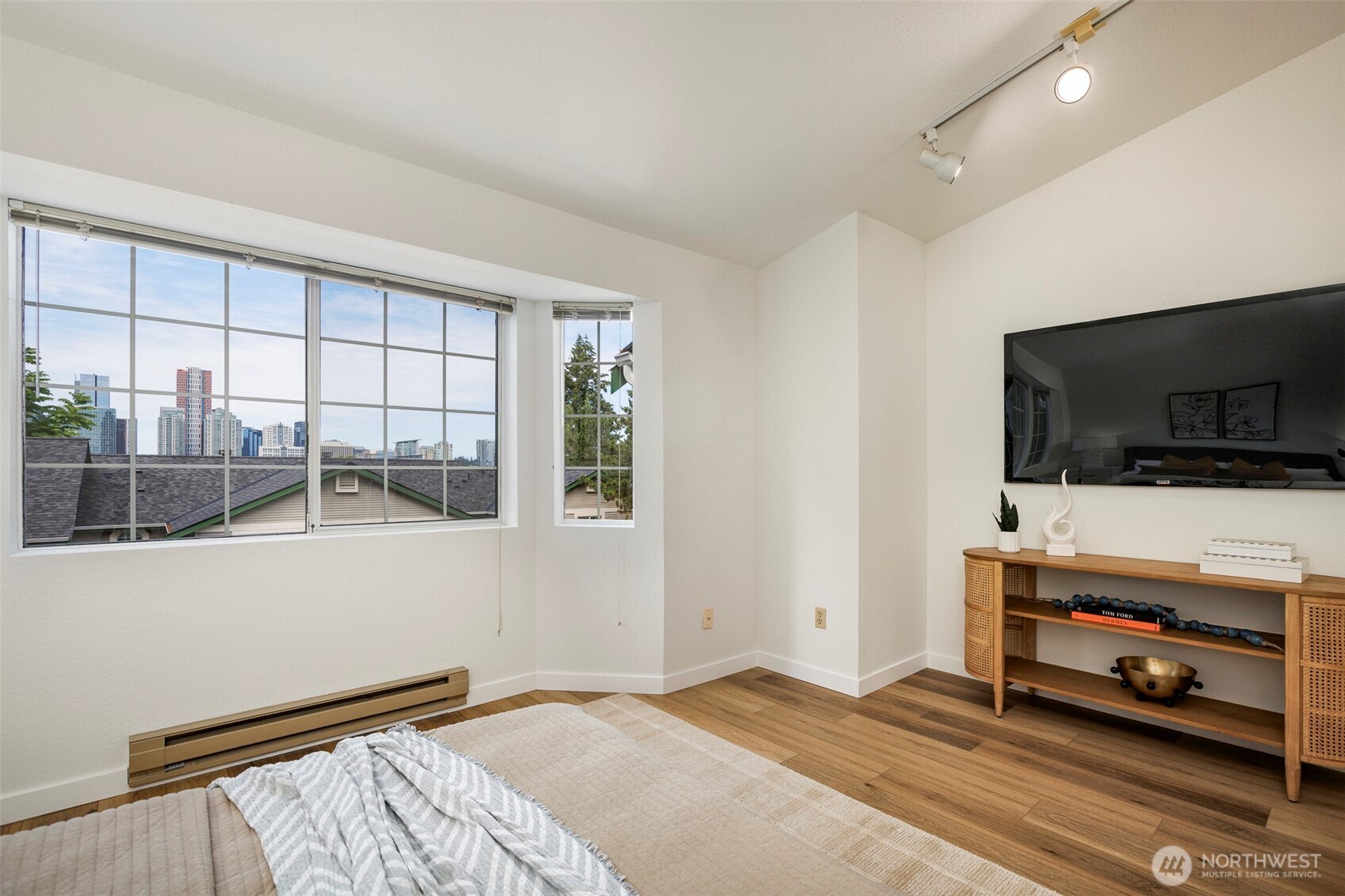 Primary bedroom with a view of down town Bellevue
