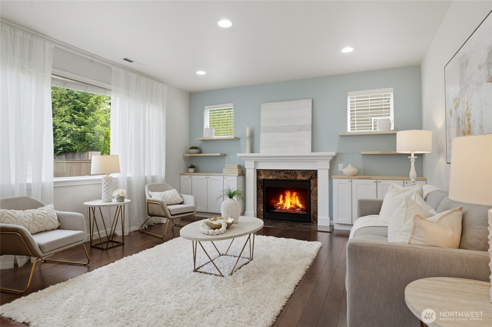 Comfortable living area with gas fireplace and newer custom builtins!