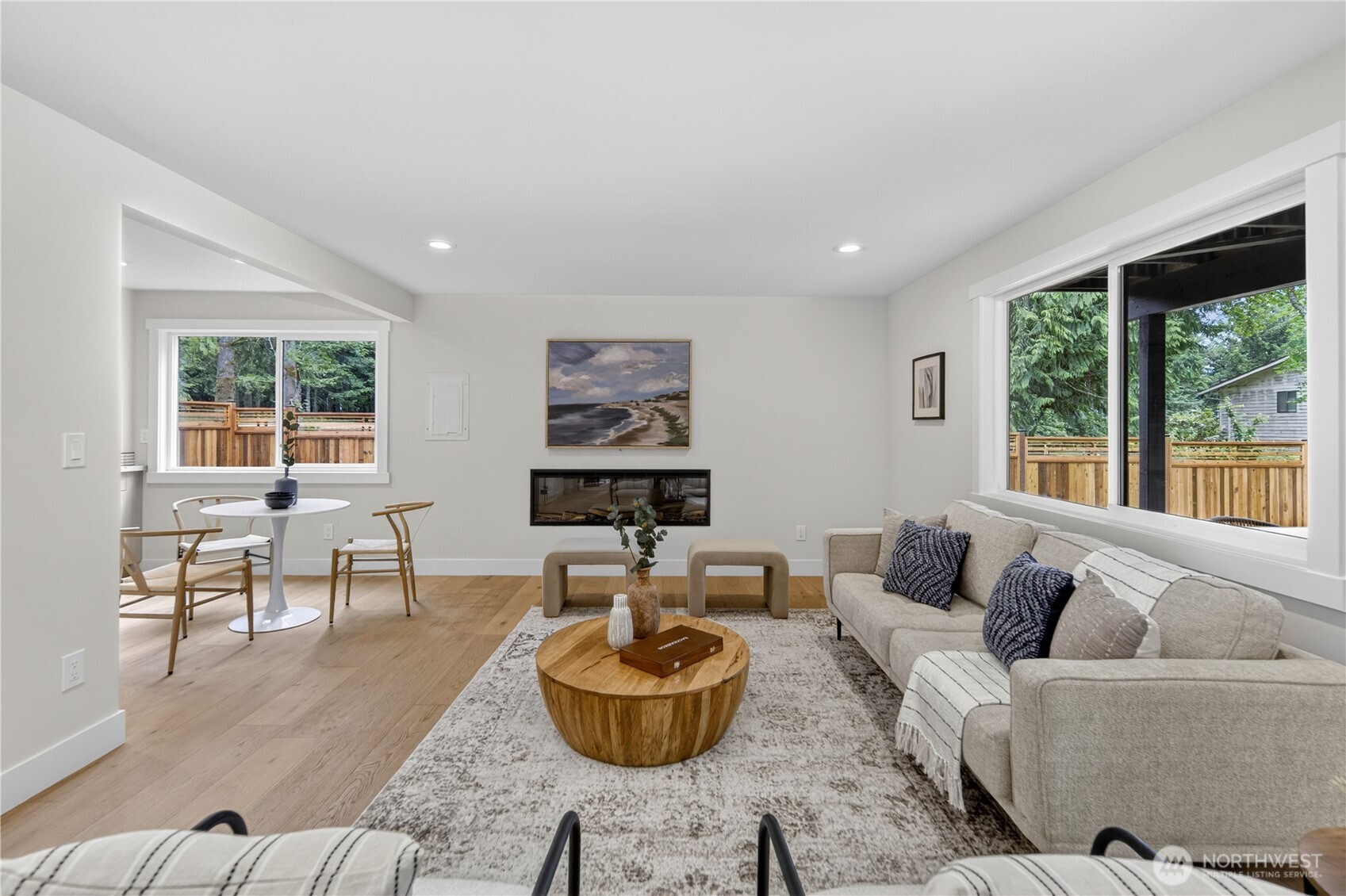 The home’s thoughtful, refreshing remodel continues on the lower level, where freshly painted soft off-white walls and bright white trim carry the elevated color palette downstairs. New luxury engineered hardwood floors add beauty, warmth, and easy care, with new recessed lighting giving the room an even, welcoming glow. The electric fireplace creates a warm gathering focal point, making this rec room feel comfortable, connected, and ready for everyday living.