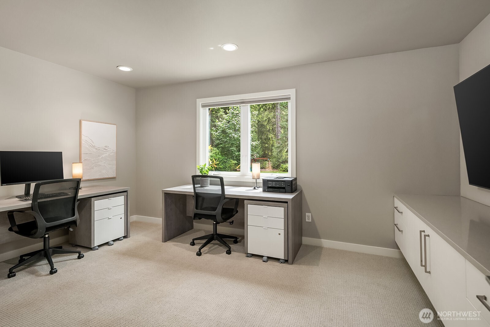 The dedicated den offers a quiet and functional work-from-home retreat, with ample space for dual workstations and bright windows that keep the room feeling open and productive.