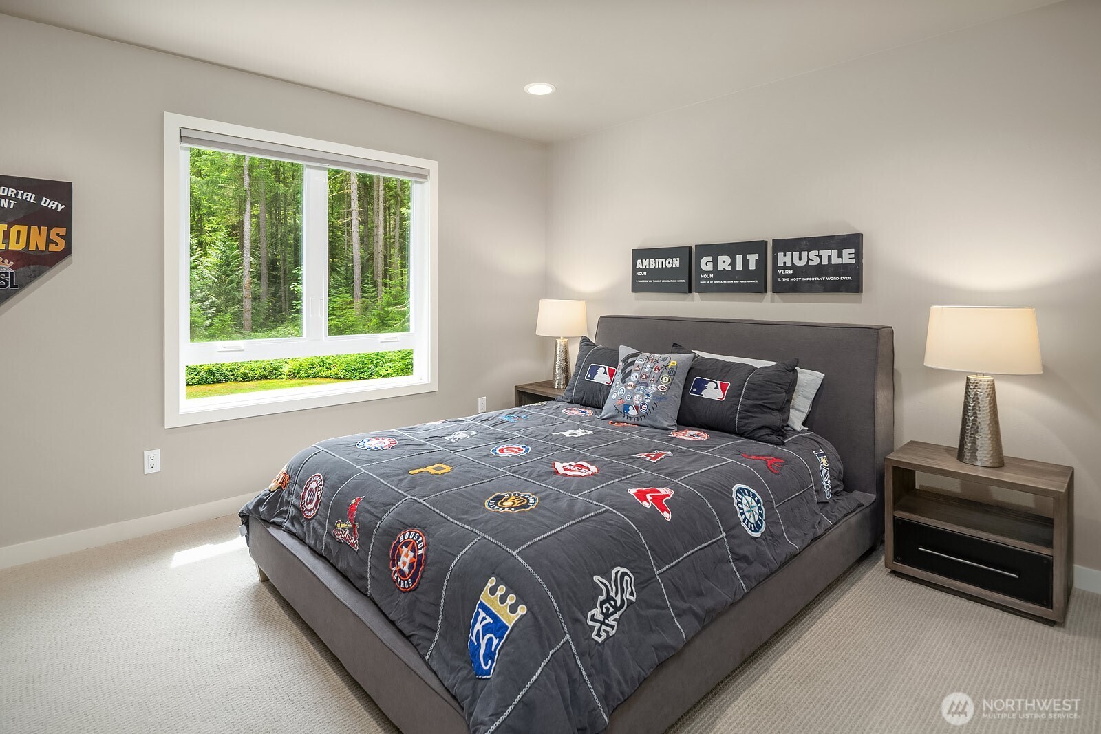 This well-sized upstairs bedroom features new windows with lush green views, neutral carpet, and clean finishes, providing a comfortable and private space for family or guests.