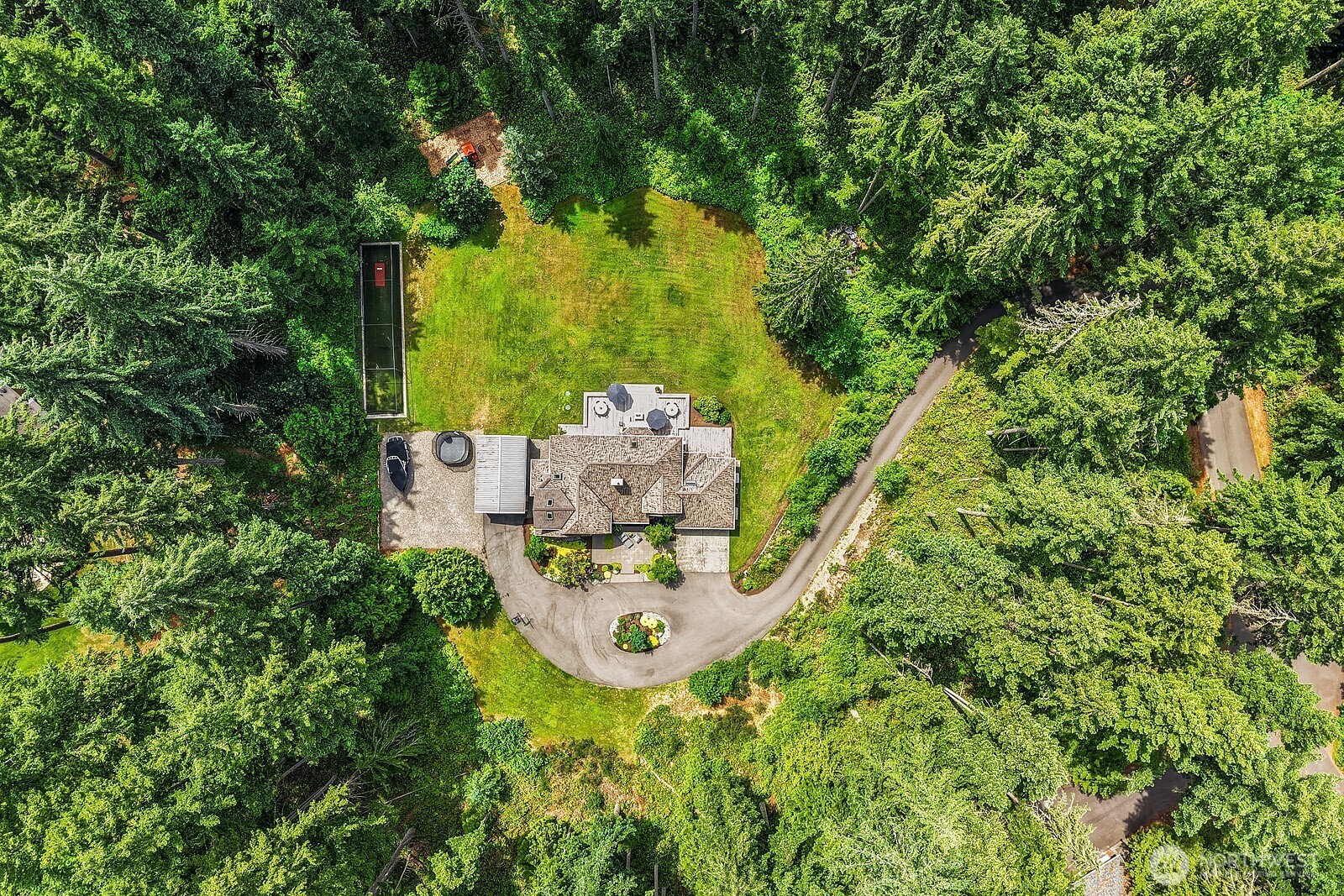 This high aerial view illustrates the remarkable privacy and seclusion this property offers, with the home and its usable acreage nestled entirely within a lush, tree-lined setting in sought-after Union Hill.