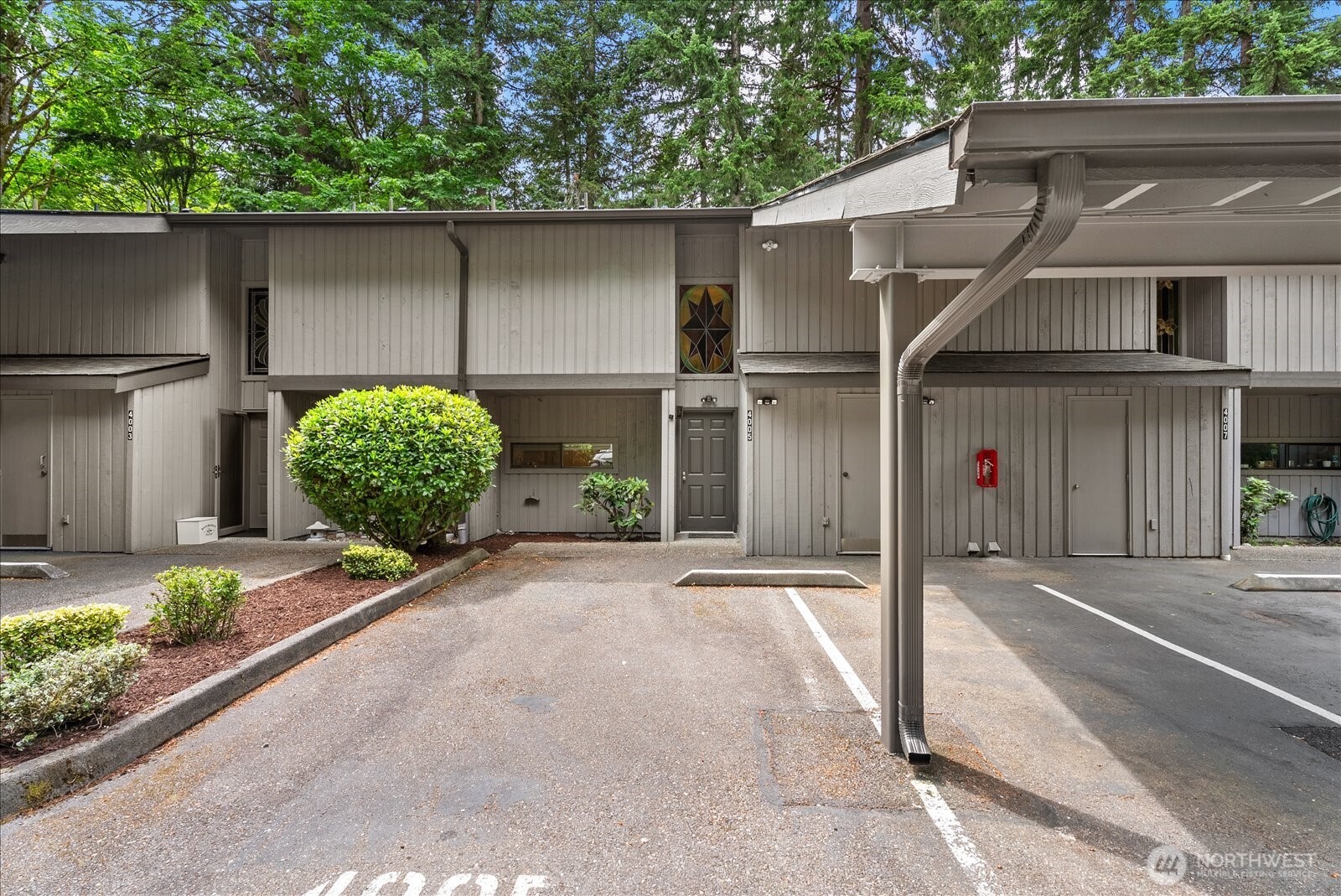2 dedicated parking spaces. Storage unit at the front of the covered parking space.