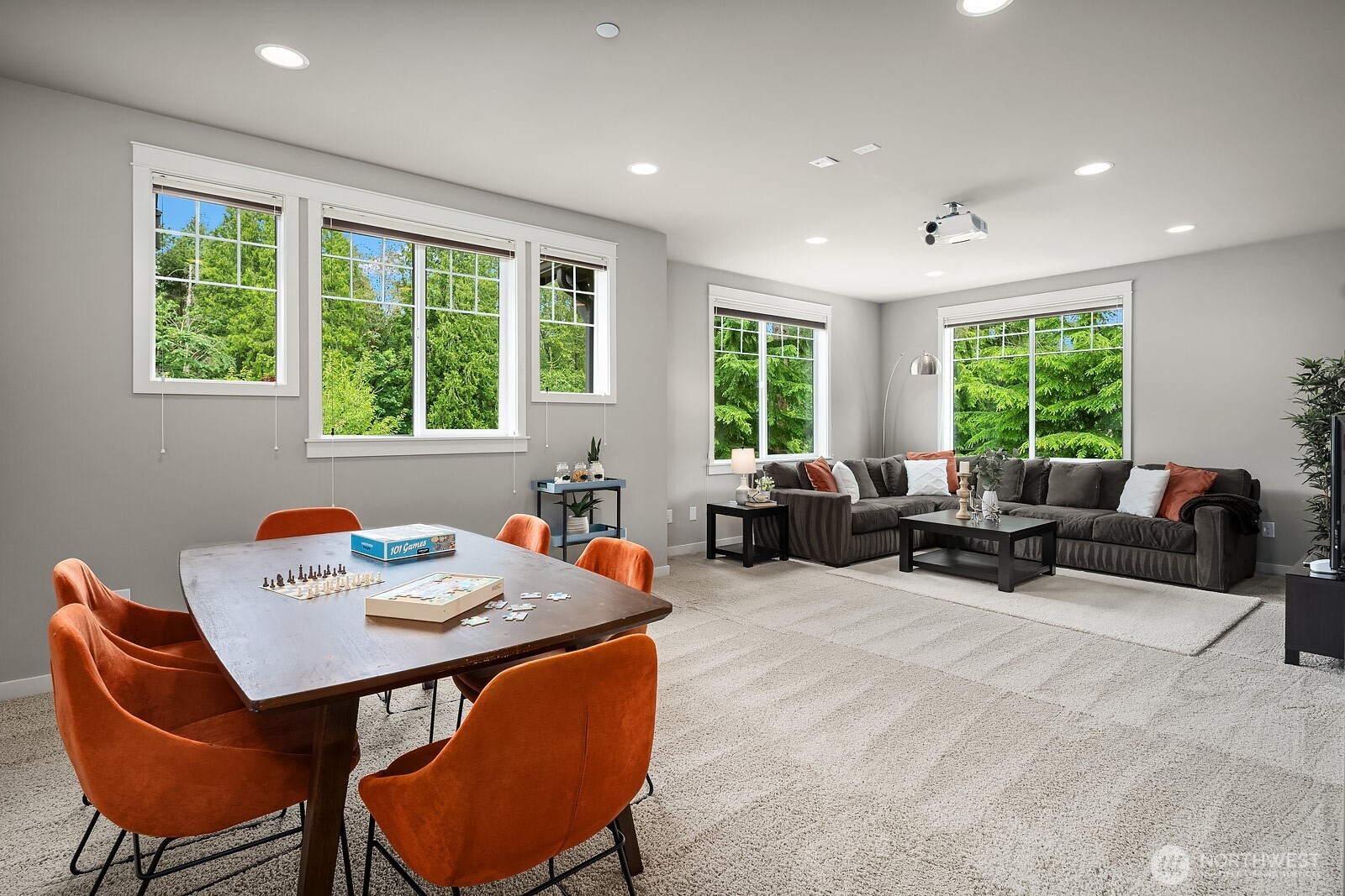 The large upper level bonus room is a standout feature, offering exceptional flexible space bathed in natural light from multiple windows with treetop views. Whether used as a media room, playroom, or secondary living area, this generous space adds tremendous versatility to the home.