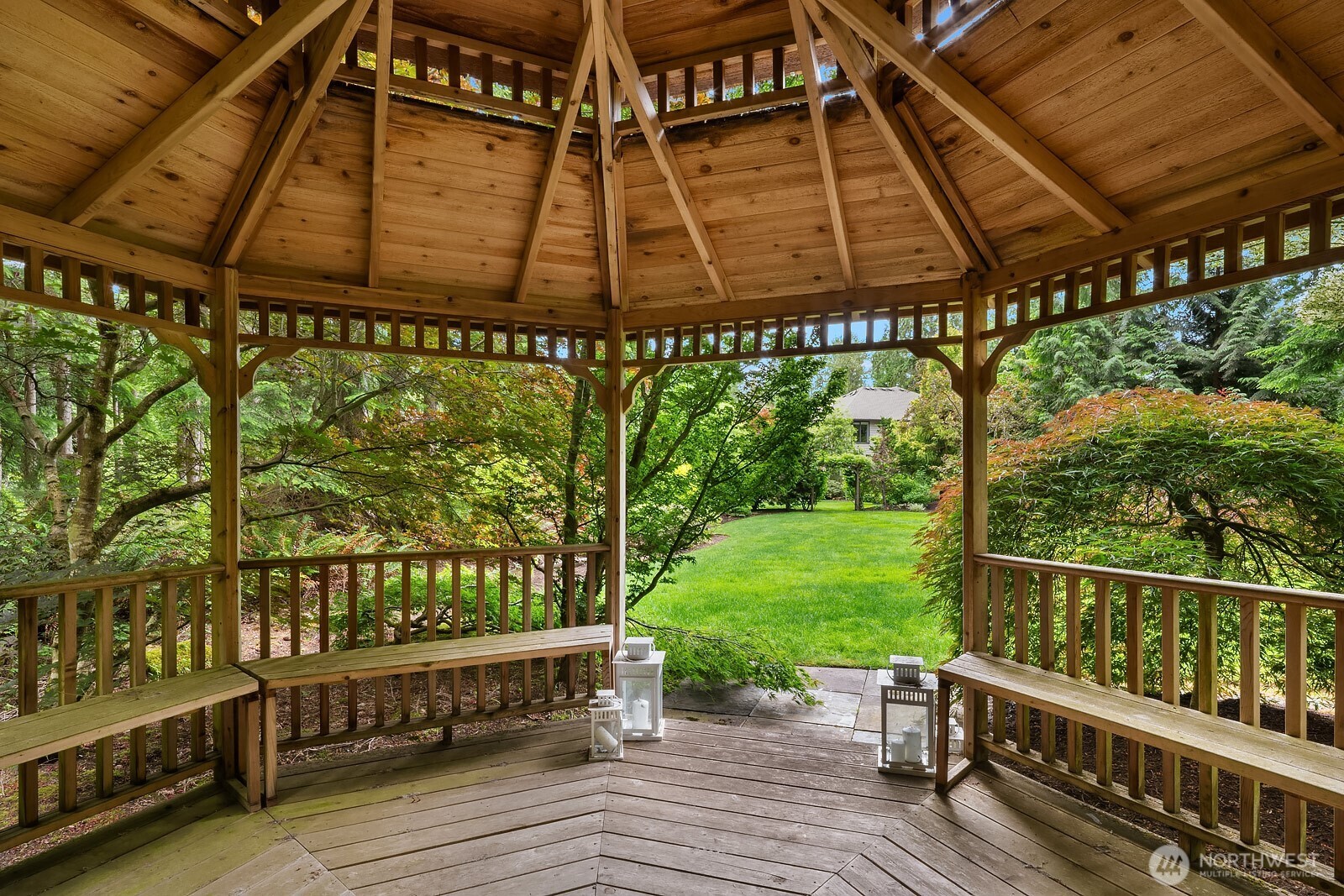 Another stunning view of the koi pond showcases the multiple waterfalls, vibrant Japanese maples, and meticulously curated landscape that make this backyard a truly one-of-a-kind outdoor sanctuary.