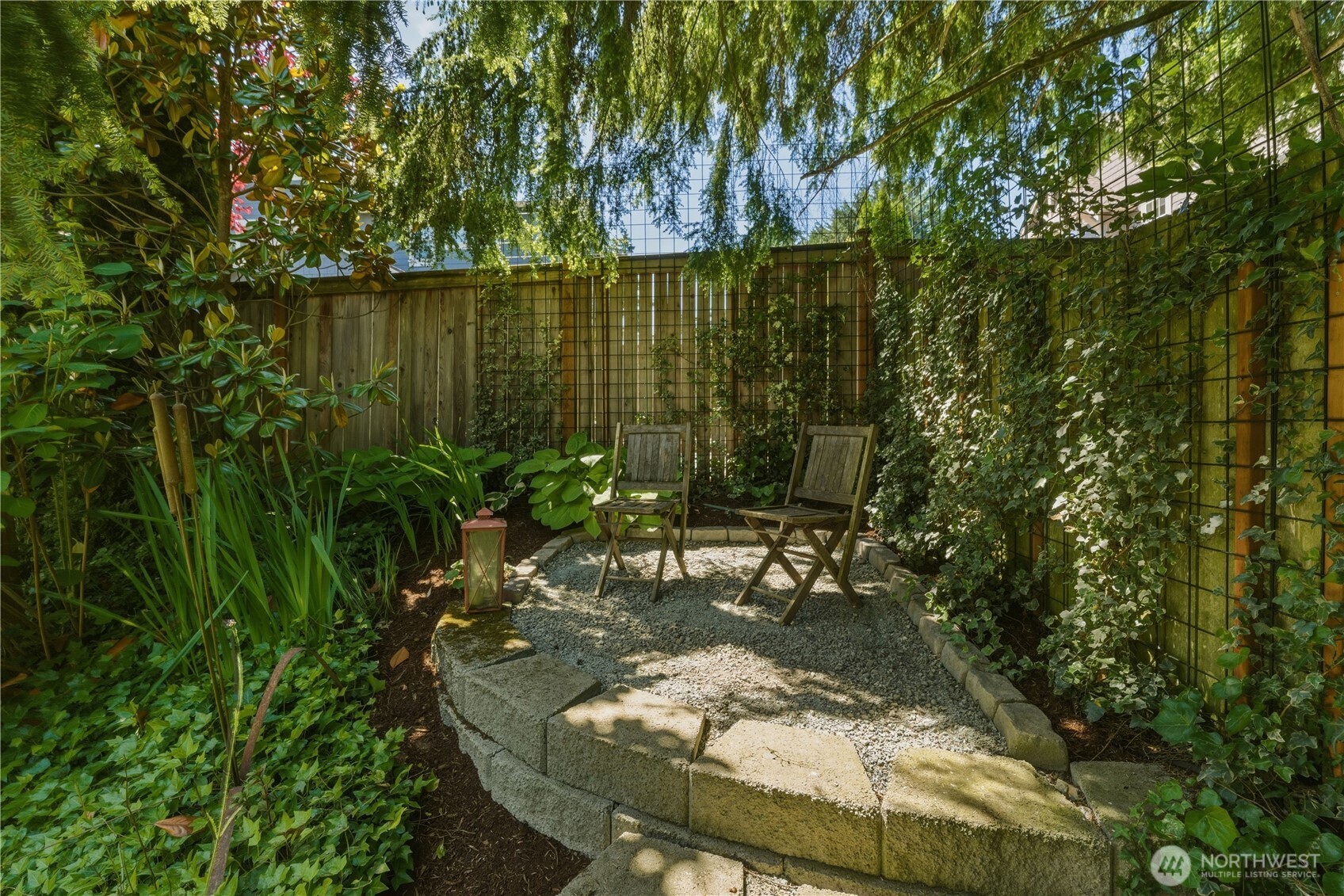 Step outside the main floor office to the mound, a peaceful little perch with views across the whole garden