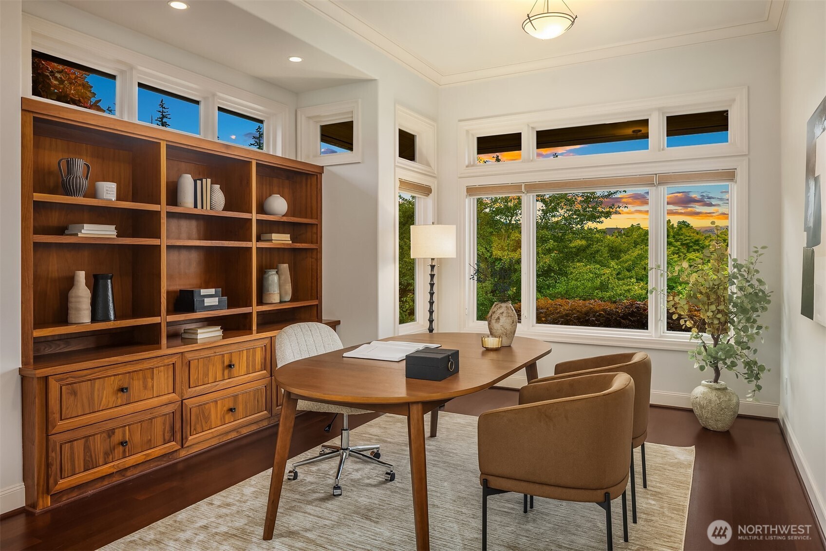 Main level Den features built in bookcase, views of Summit park and french doors out to patio.