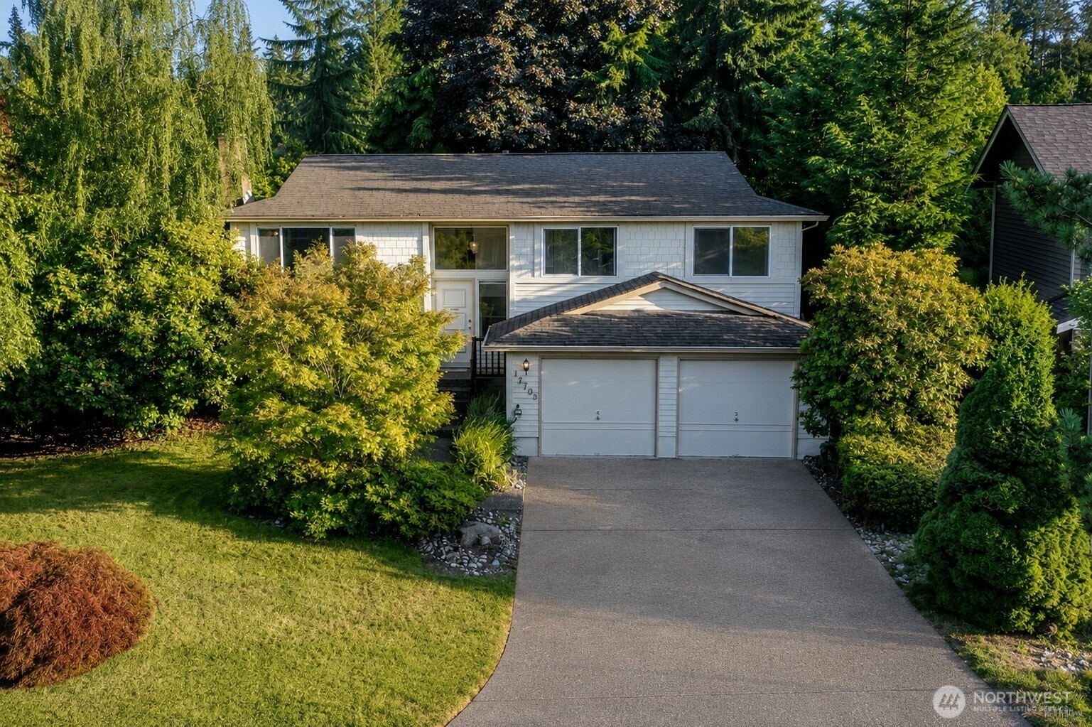 Well maintained home on spacious lush lot with mature landscaping.