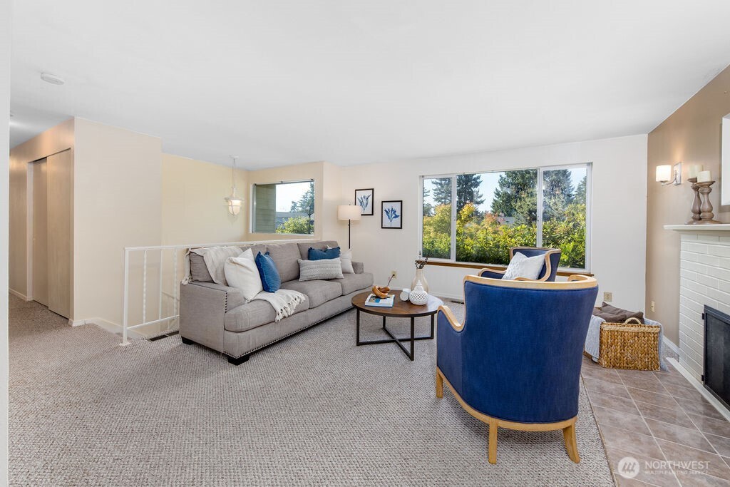 Wood burning fireplace. The living enjoys a bird's eye view of the neighborhood.