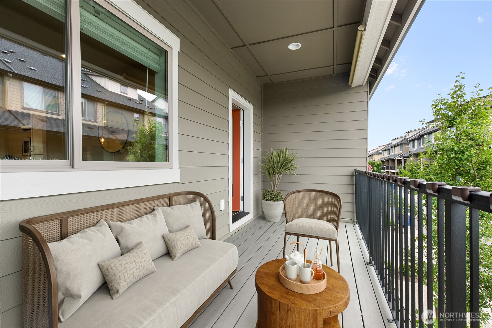 A covered overed deck extends the living space all summer long. (Virtually staged)