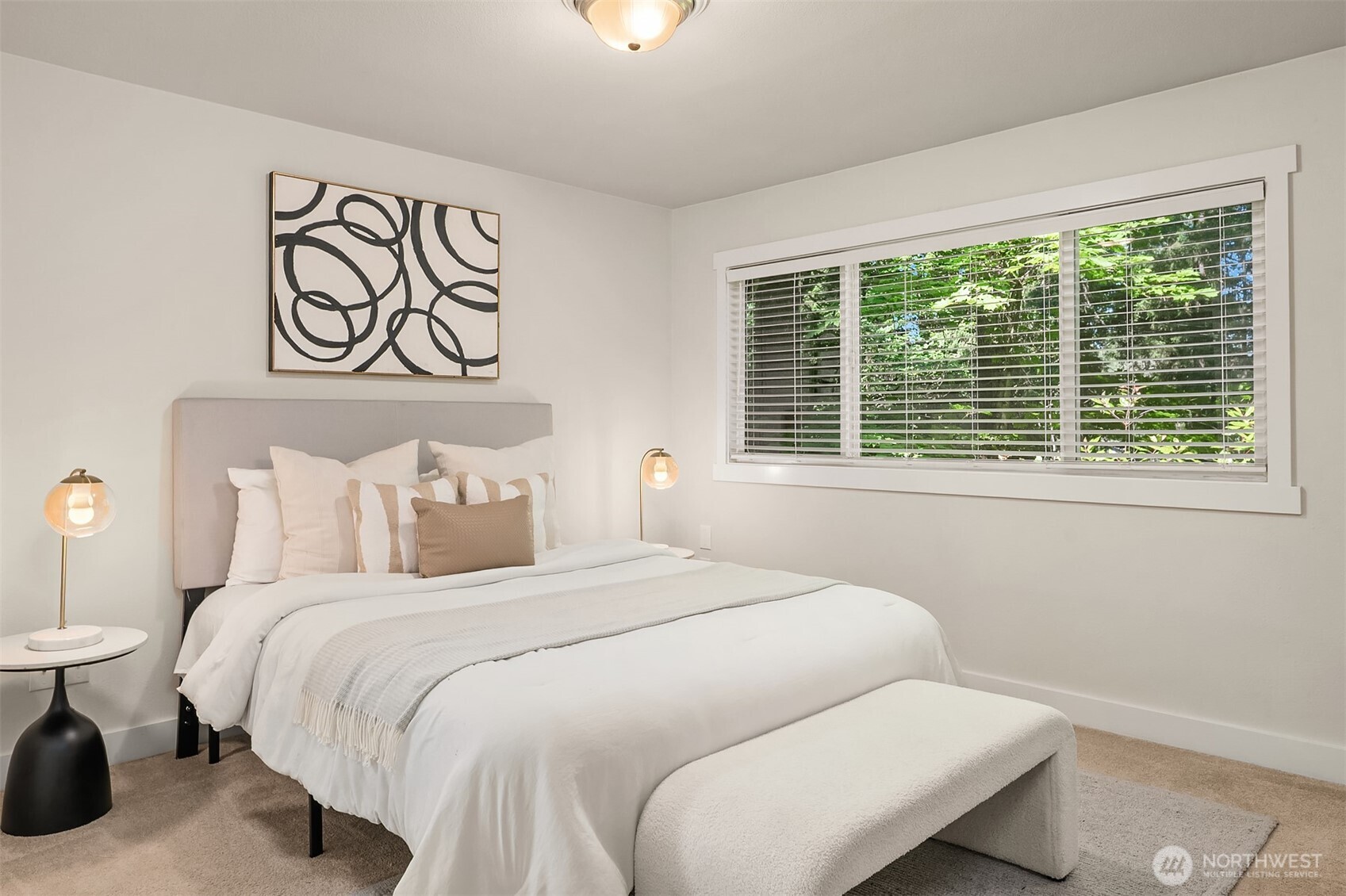 Upper level primary bedroom w/ walk in closet.