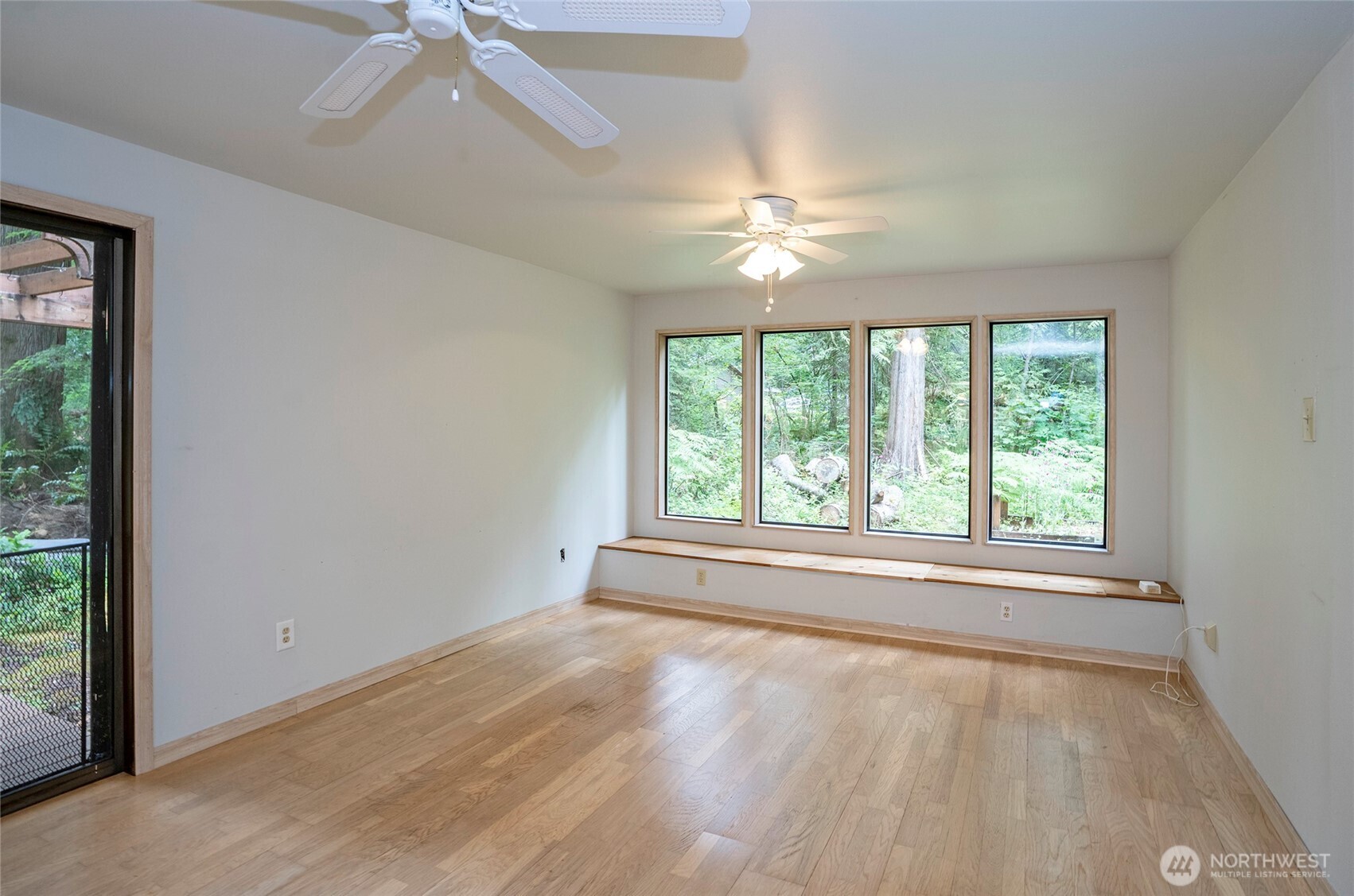 Built-in bench seating with serene views of the natural setting—perfect for relaxing and unwinding.