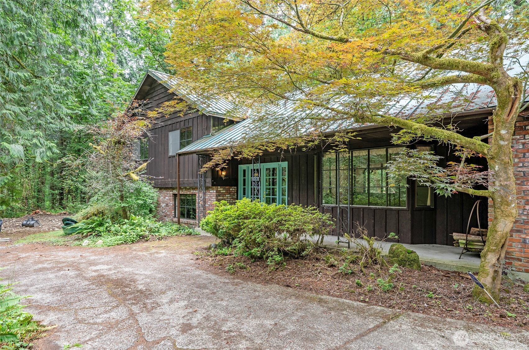 Beautiful glass front entry doors create a welcoming first impression, while the covered front porch offers the perfect place to relax and enjoy the tranquil surroundings.