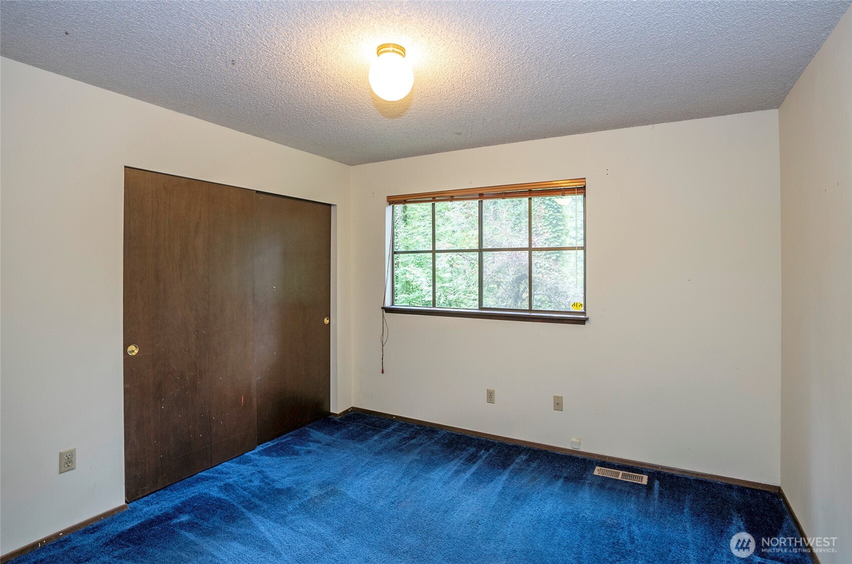 Upper-level guest suite #2 with generous closet space.