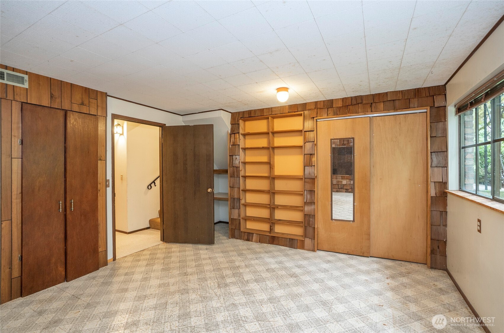Lower-level recreation room with endless possibilities for use and customization.