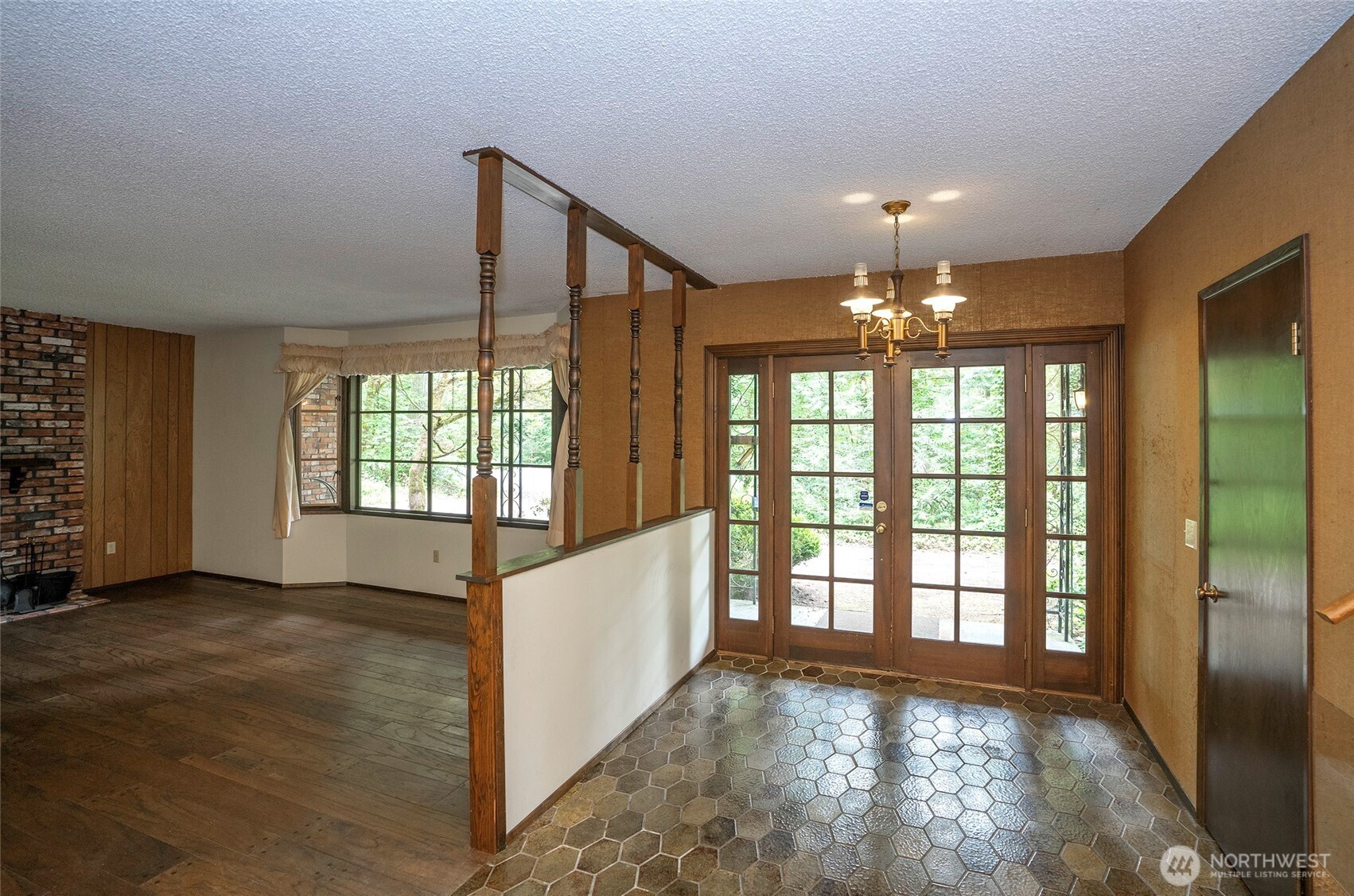 Step inside through grand glass front doors that create a stunning and welcoming first impression.