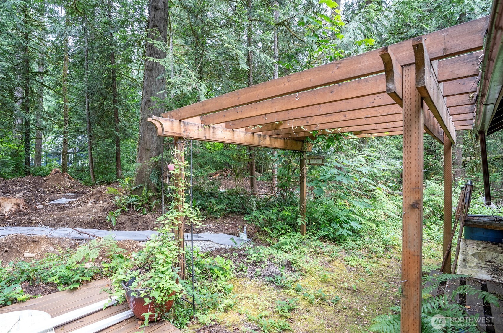 Backyard arbor awaits your personal touch.