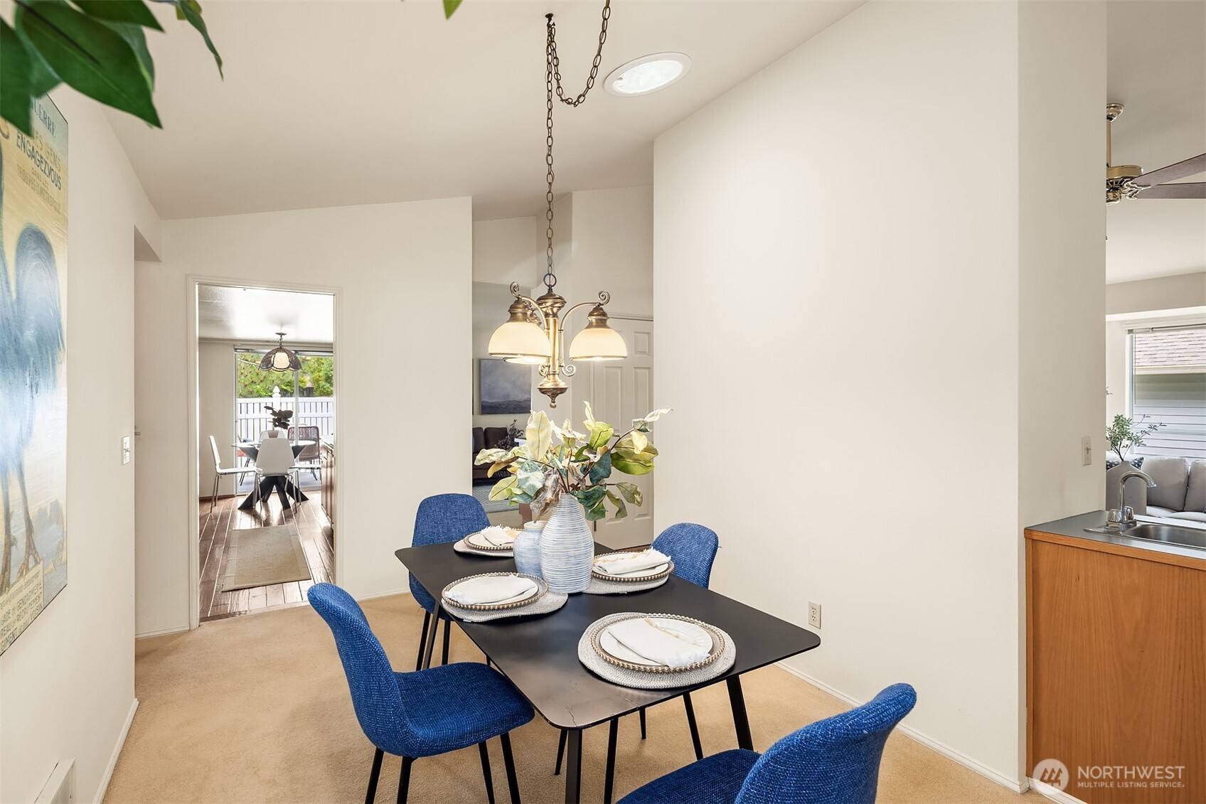 Another angle of dining room showing proximity to kitchen and wet bar.