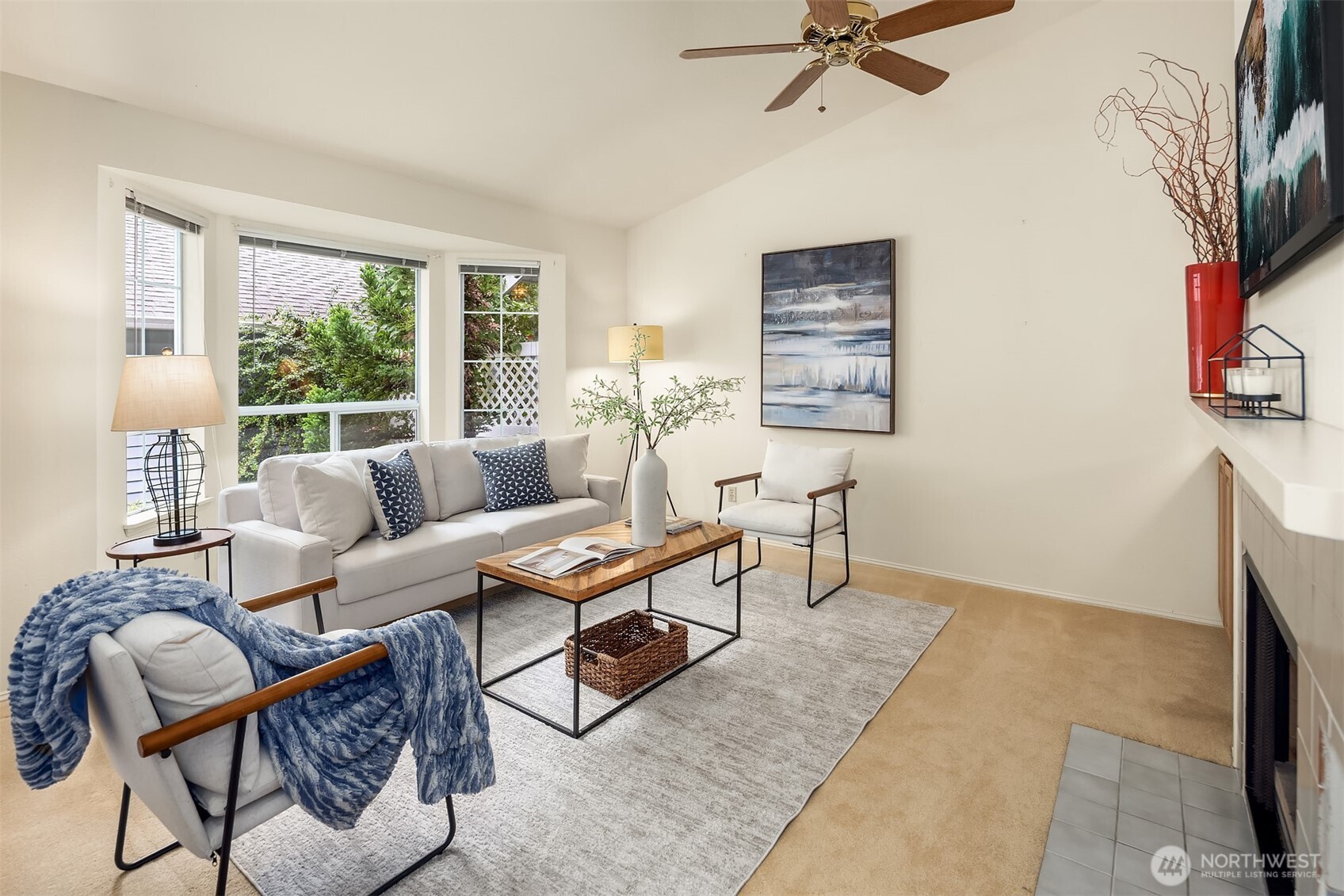 Living room at entry welcomes you with vaulted ceilings.