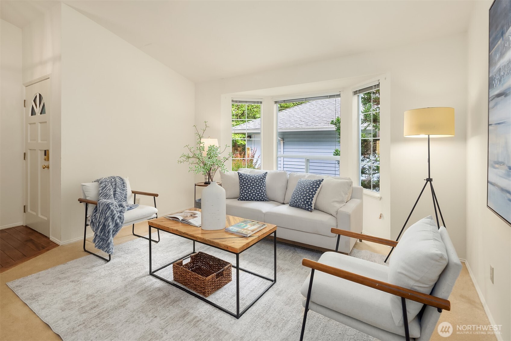 Living room with bay window overlooking private courtyard