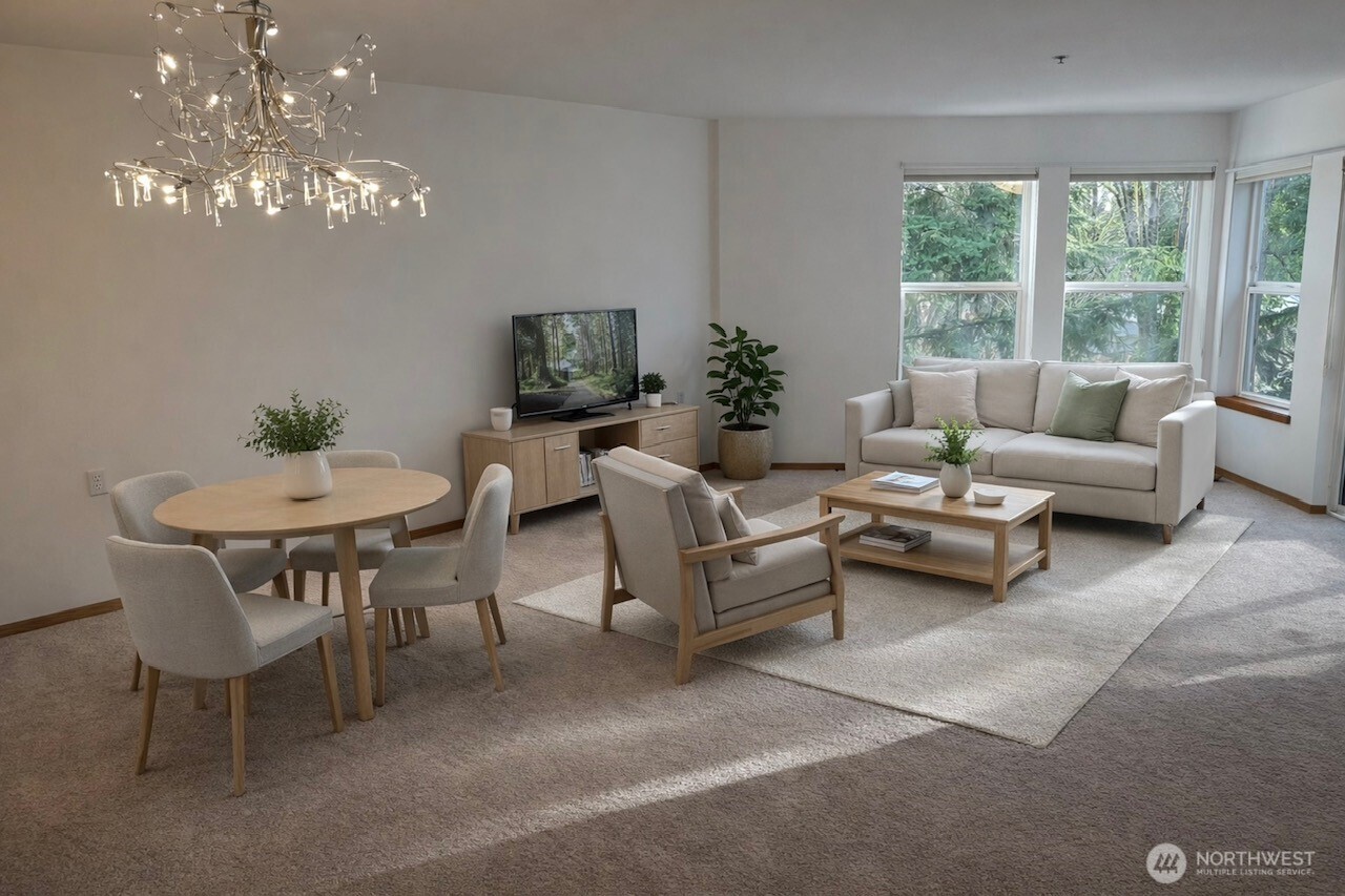 Light and bright livingroom with new lighting and deck access.