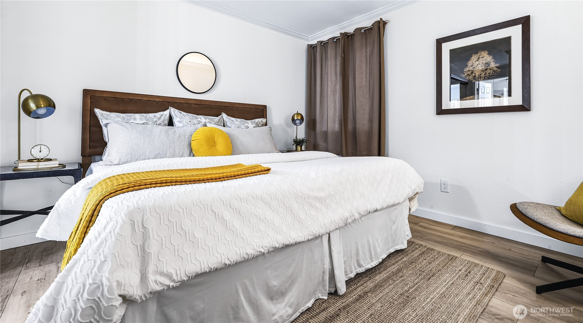 The primary suite has been enhanced by custom closet improvements and a beautifully renovated full bath.