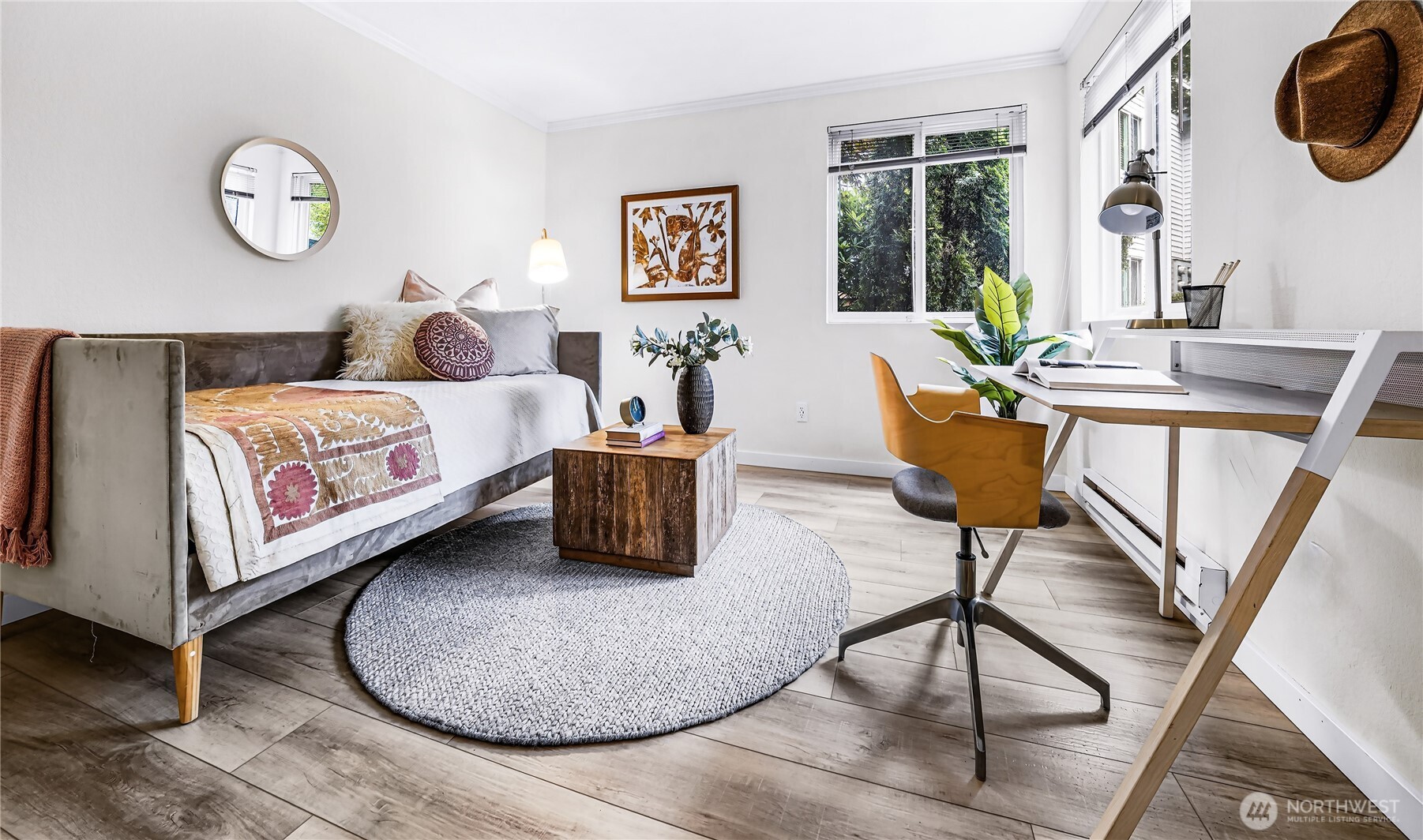 A second ensuite bedroom with updated three-quarter bath provides flexibility for guests, a home office, or both.