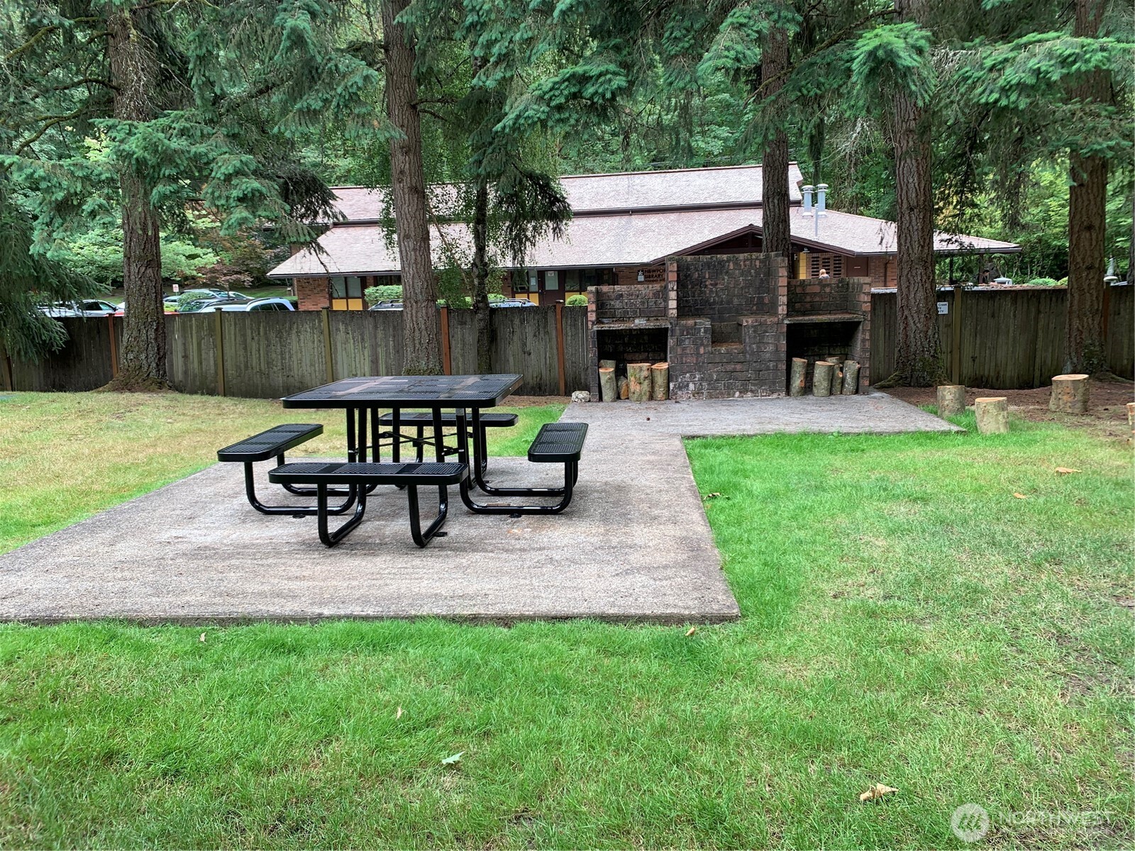 Community park has picnic area.  Library is on other side of fence.
