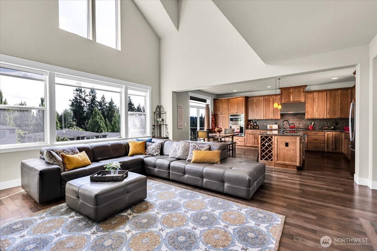 Open concept ,Sky High Windows, Vaulted Ceiling Family Room and Kitchen