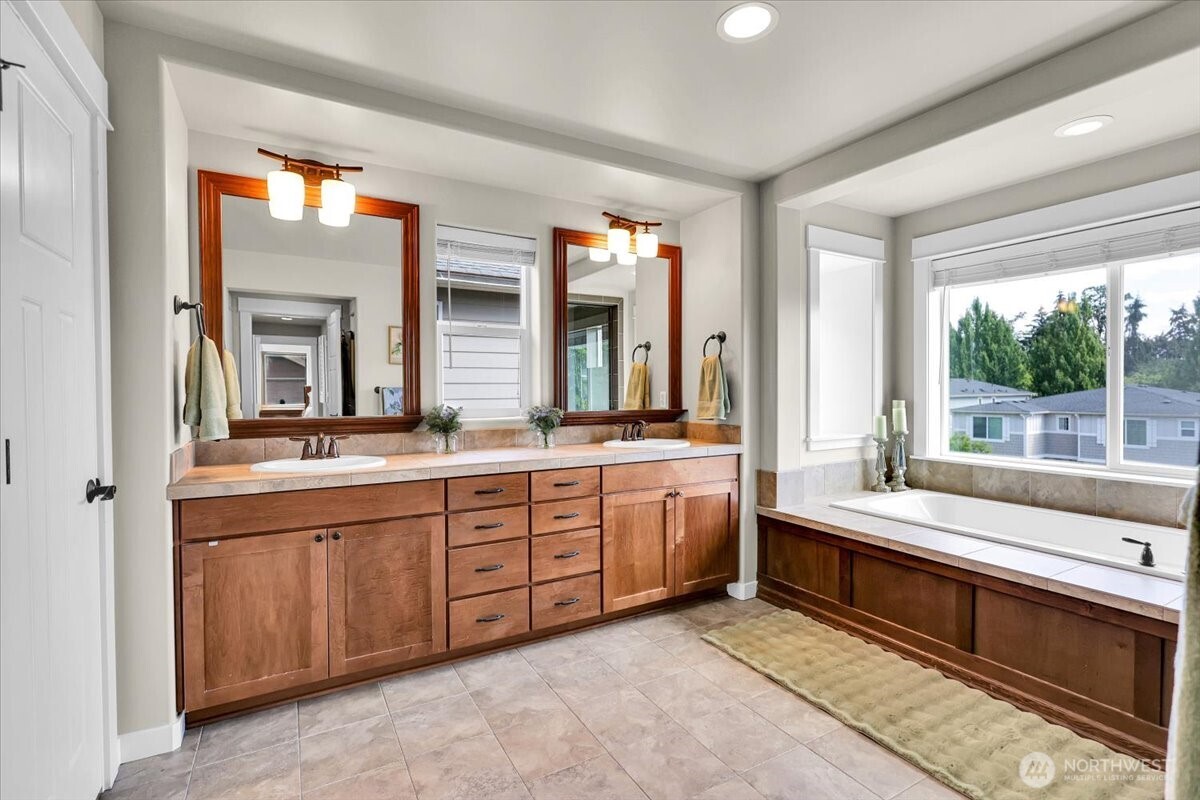 Primary Bathroom Double Sinks and Double Walk in Closets