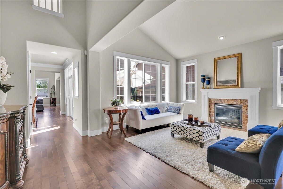Formal Living Room boasts Vaulted Ceilings & Fireplace