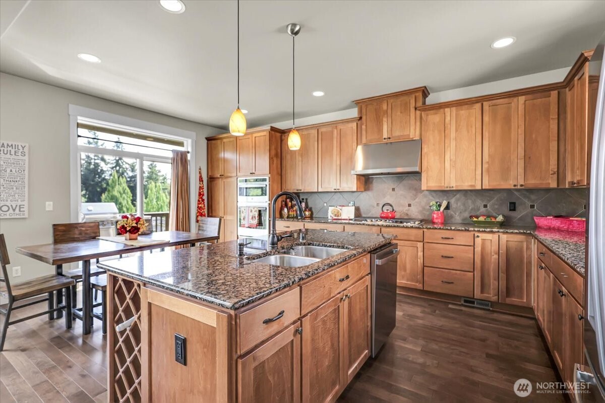 Kitchen has all new SS Appliances and a 2nd Deck overlooking the backyard