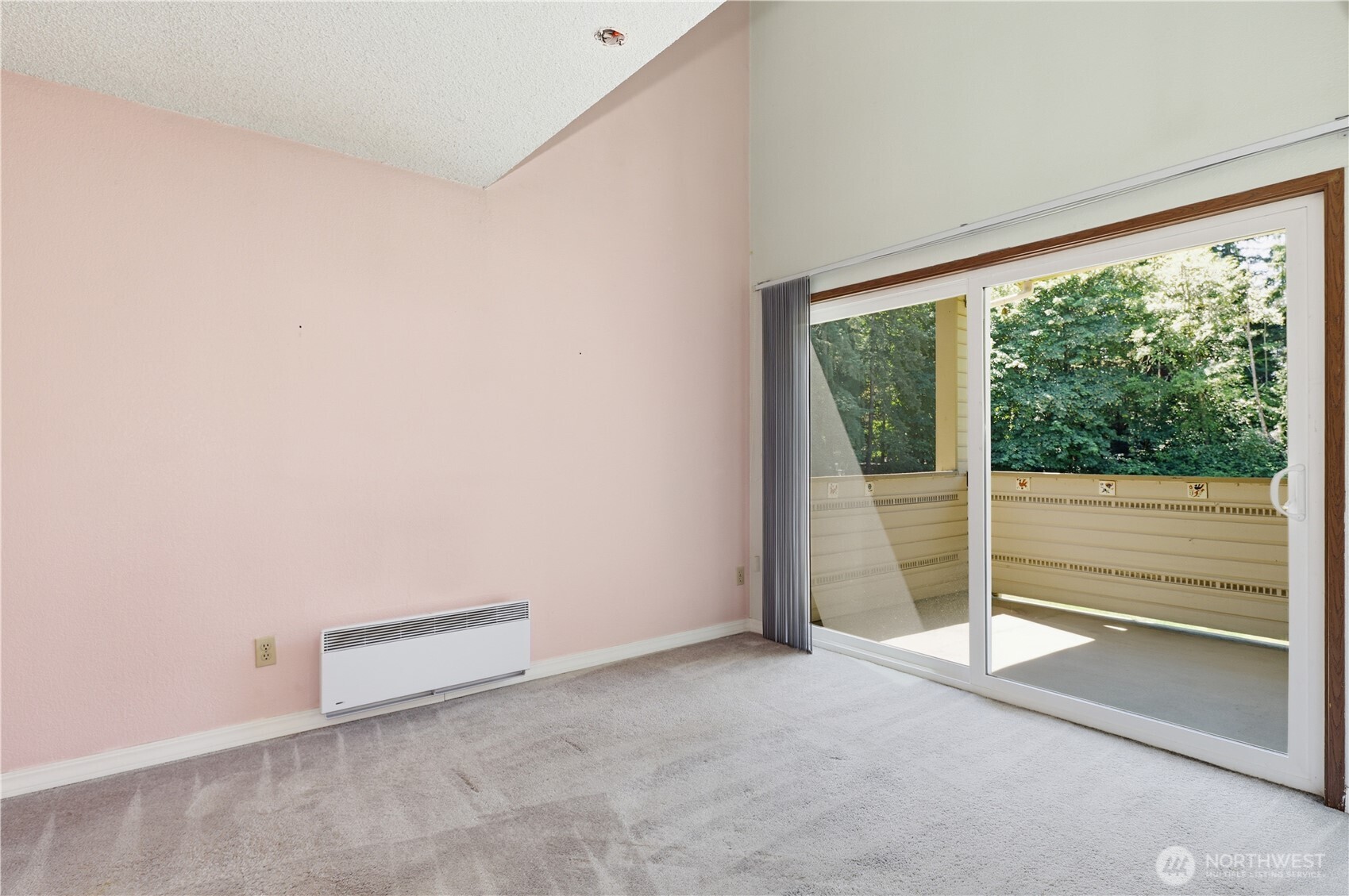 Dining area with huge sliding doors to covered deck.
