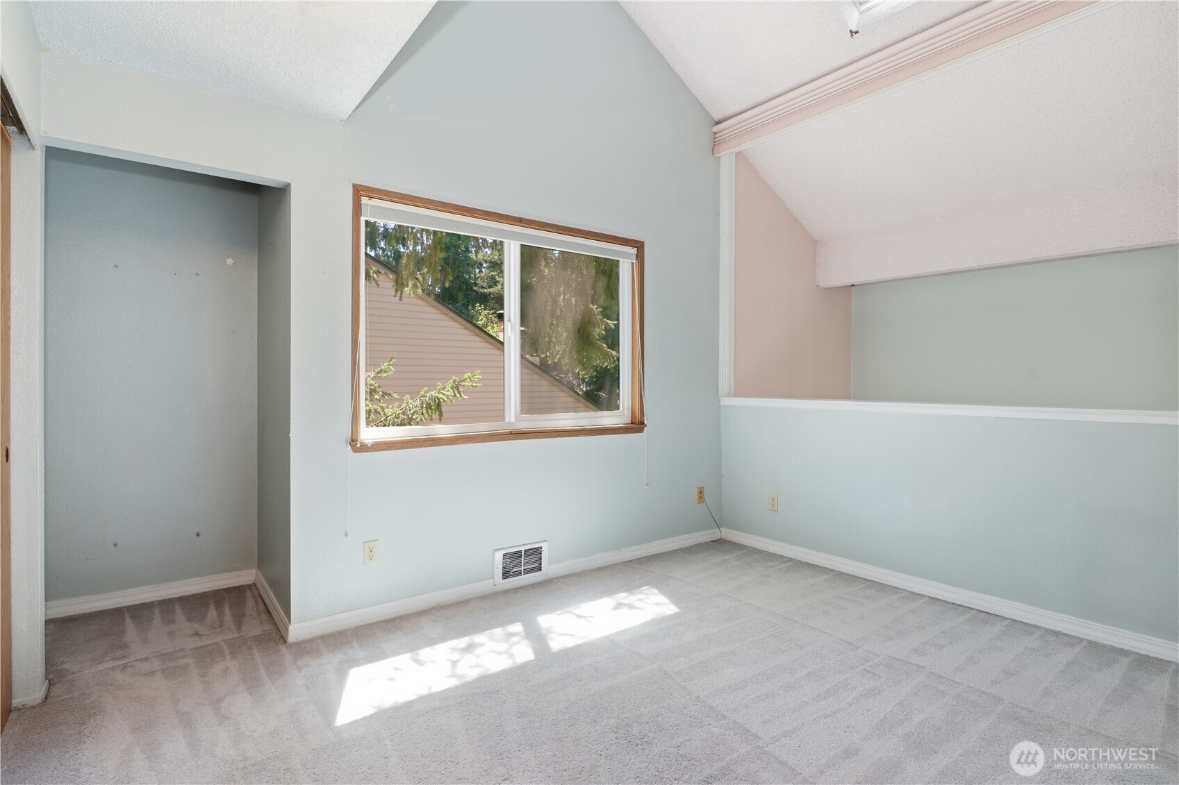 Upstairs second bedroom with a pull down shade for privacy from dining area.