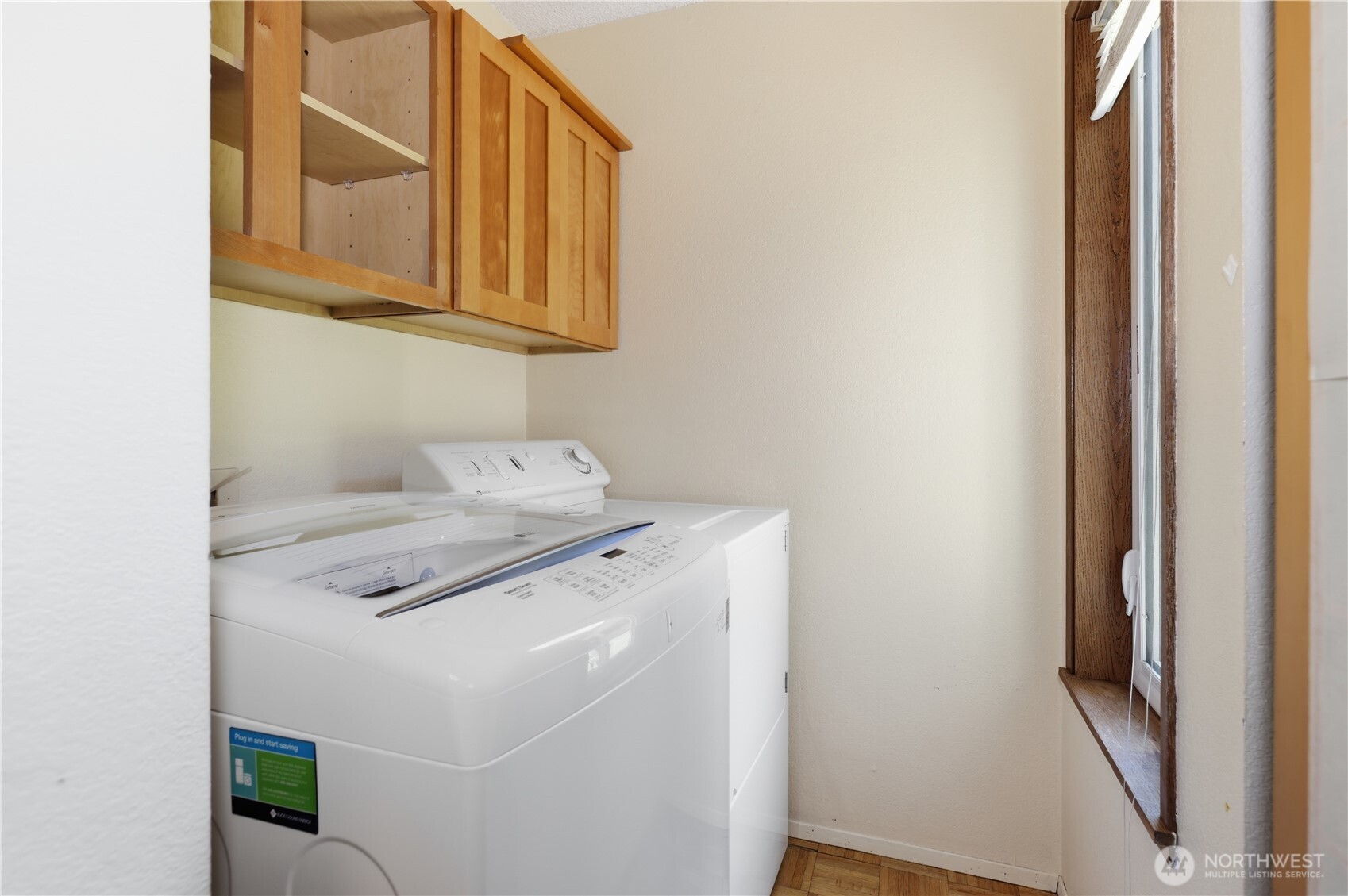 Laundry holds full size machines.